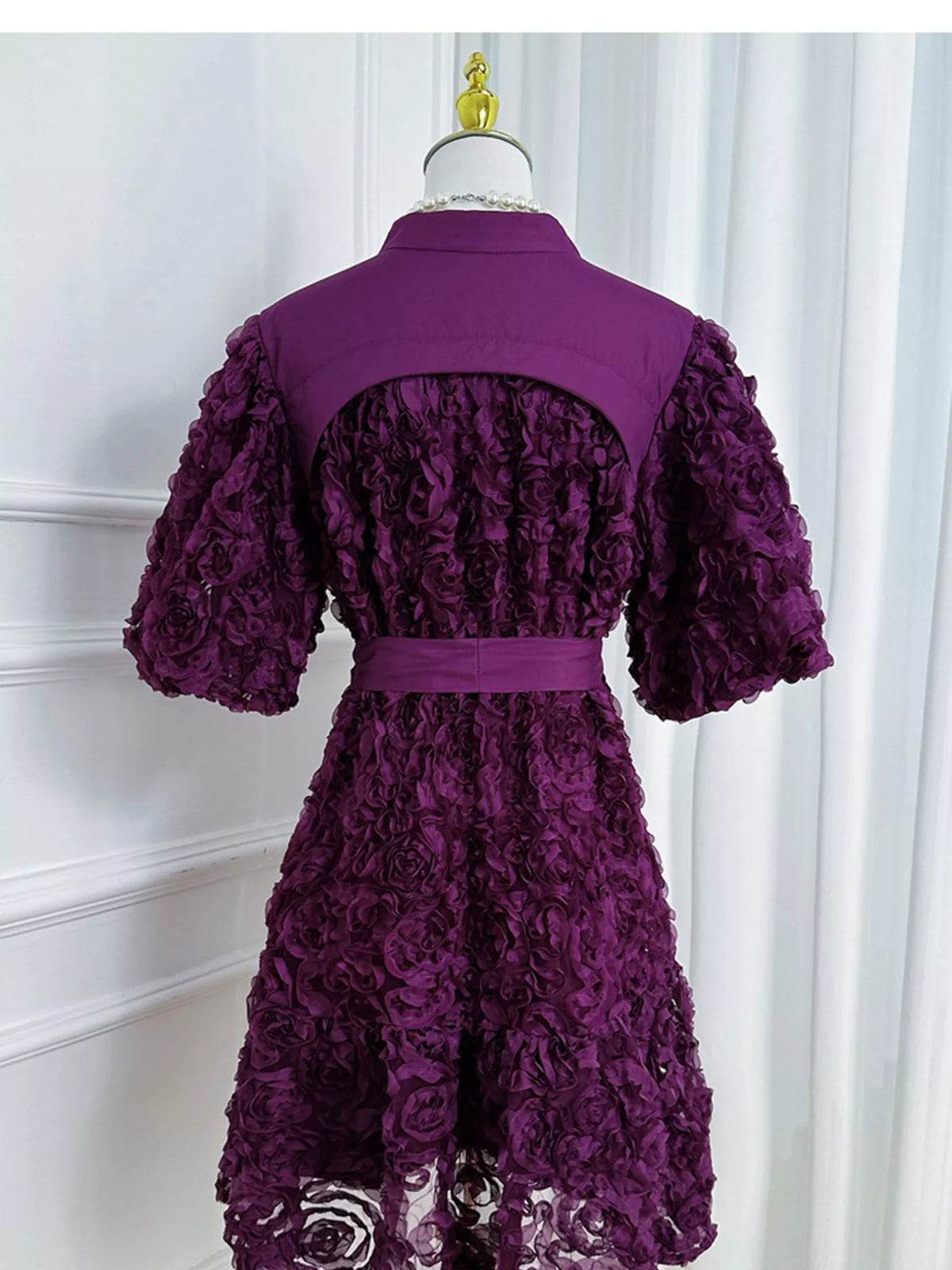 Embellished occasion dress shown from the side