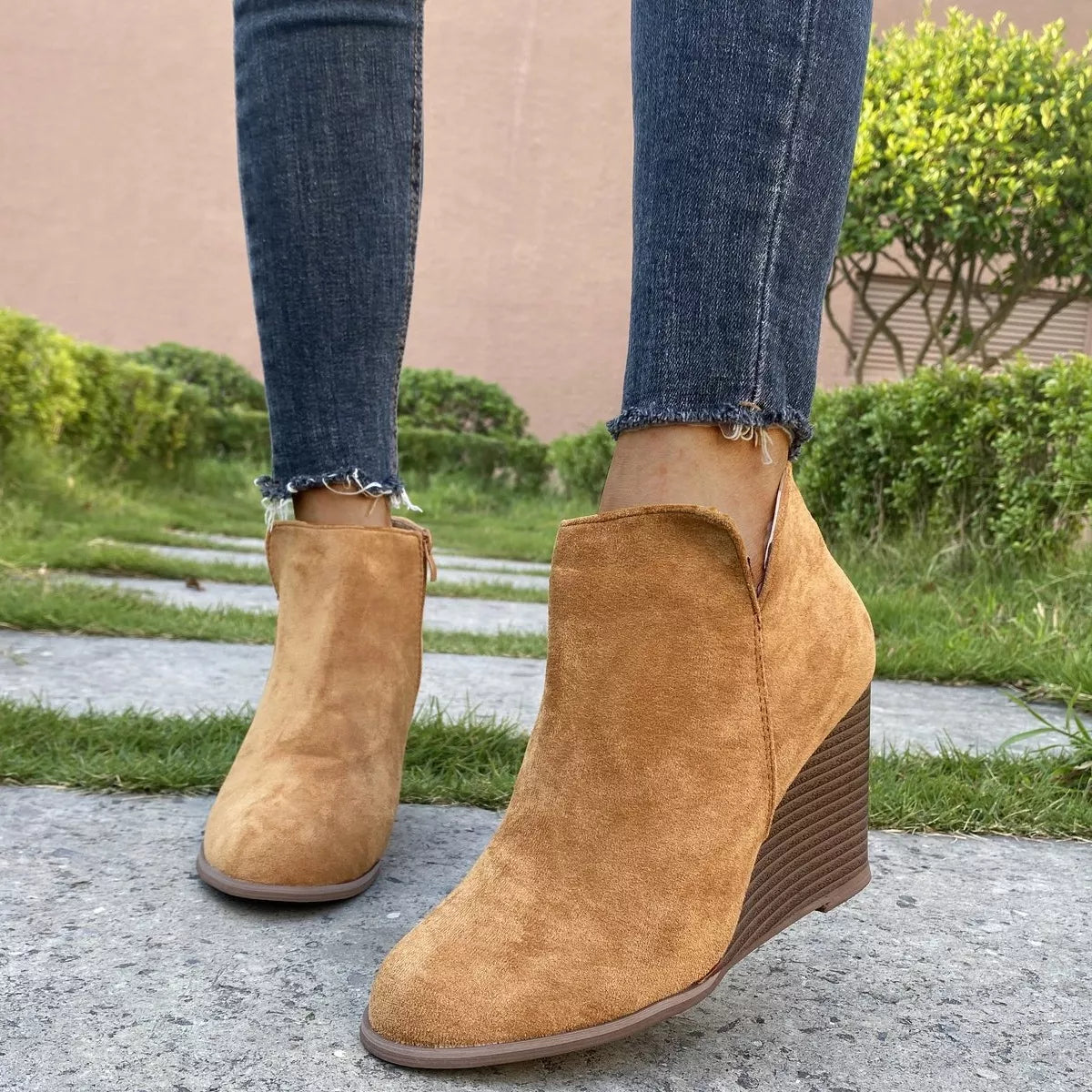 Round toe wedge ankle boots heel and sole detail
