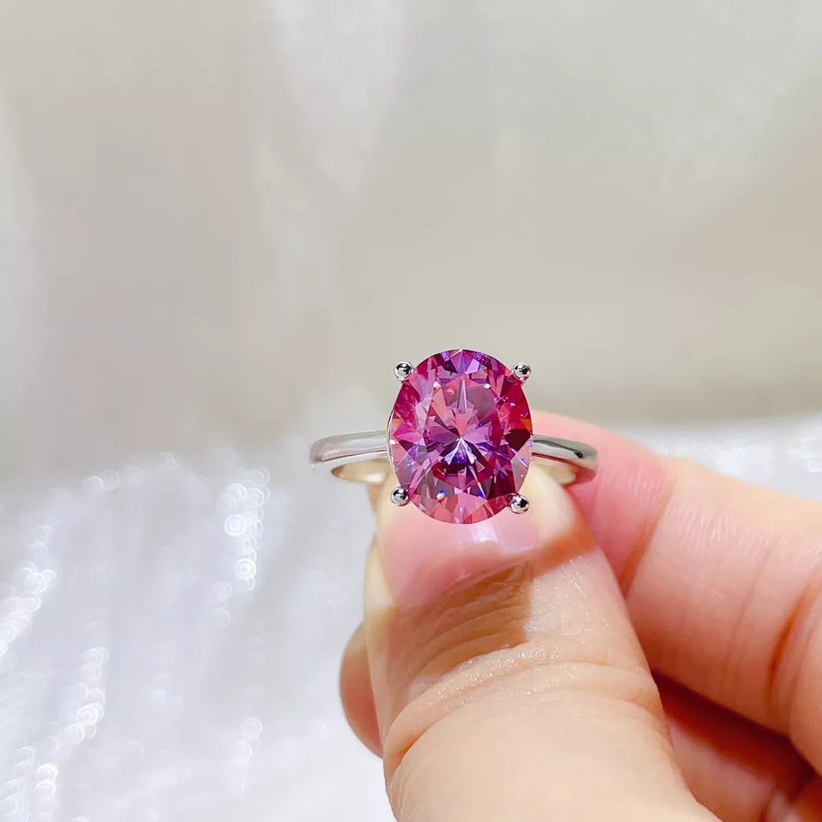 Close view of the hot pink stone and silver band