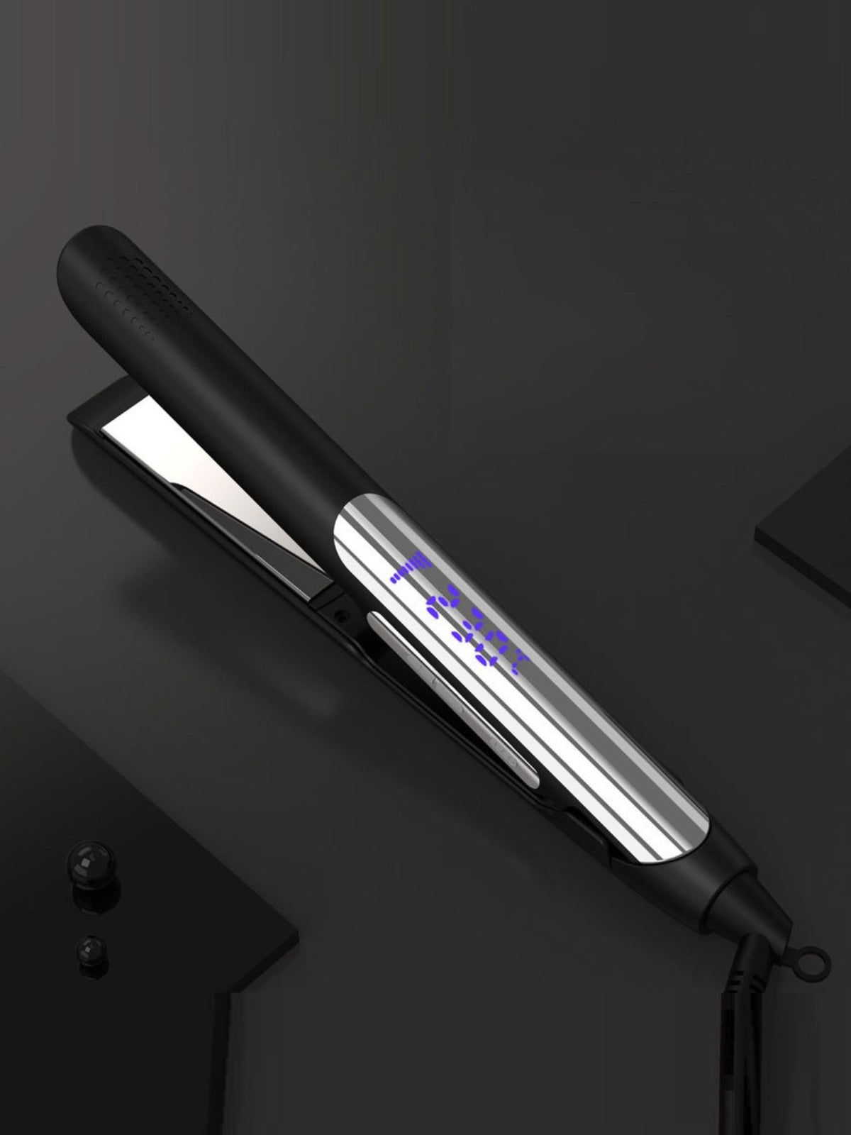 Hair straightener held in hand while styling