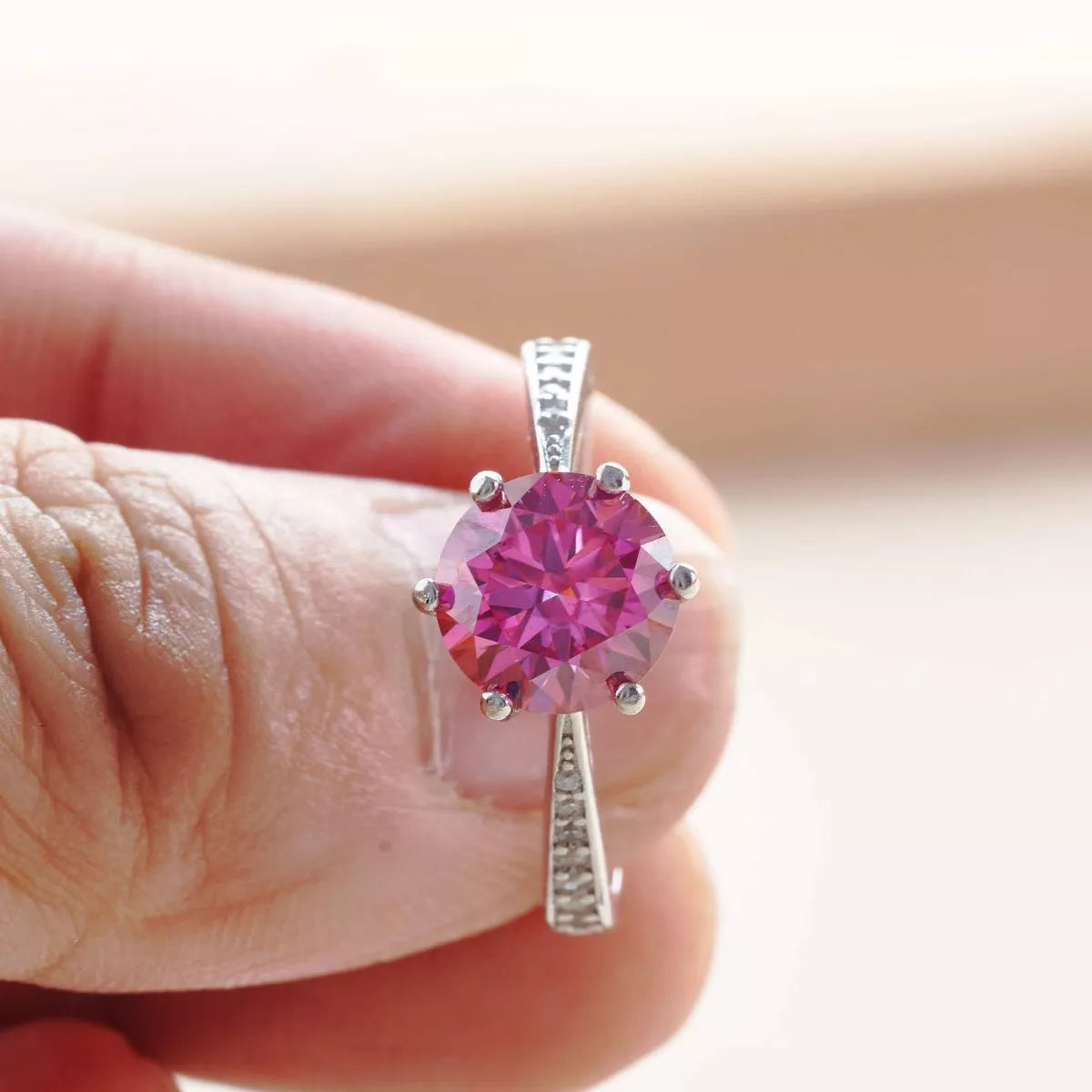 Close up of the hot pink moissanite center stone