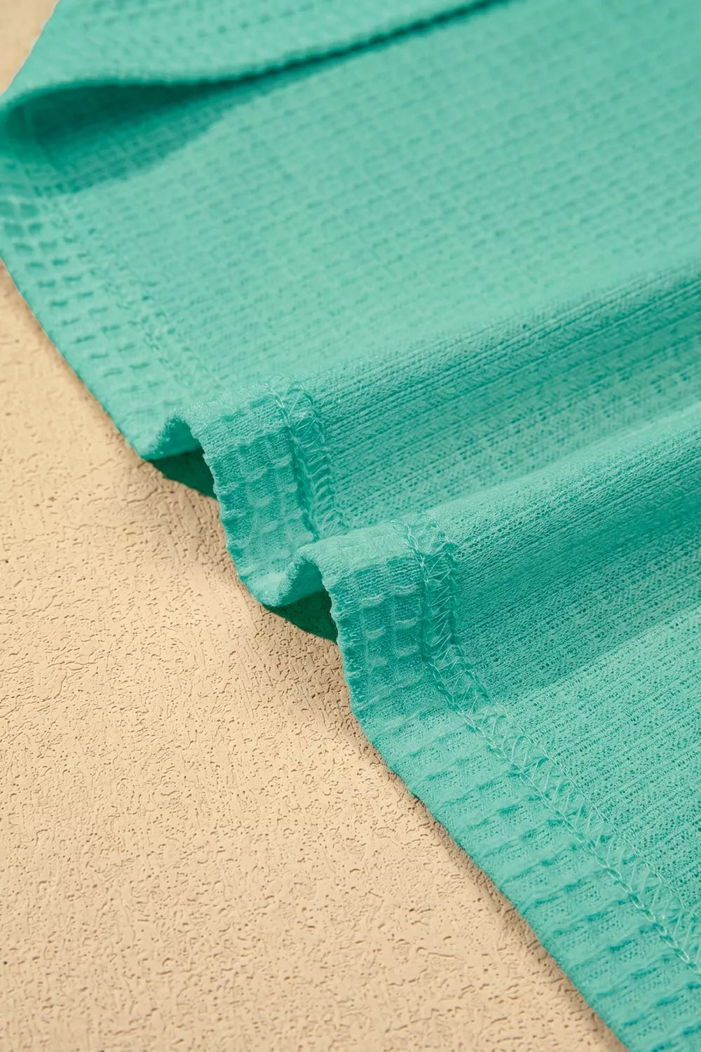 Turquoise waffle knit v neck top with lace trim front view