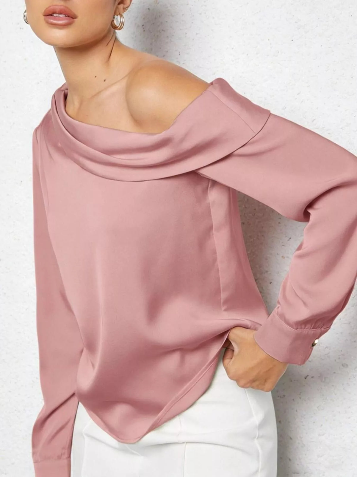 Dusty pink one shoulder blouse on model