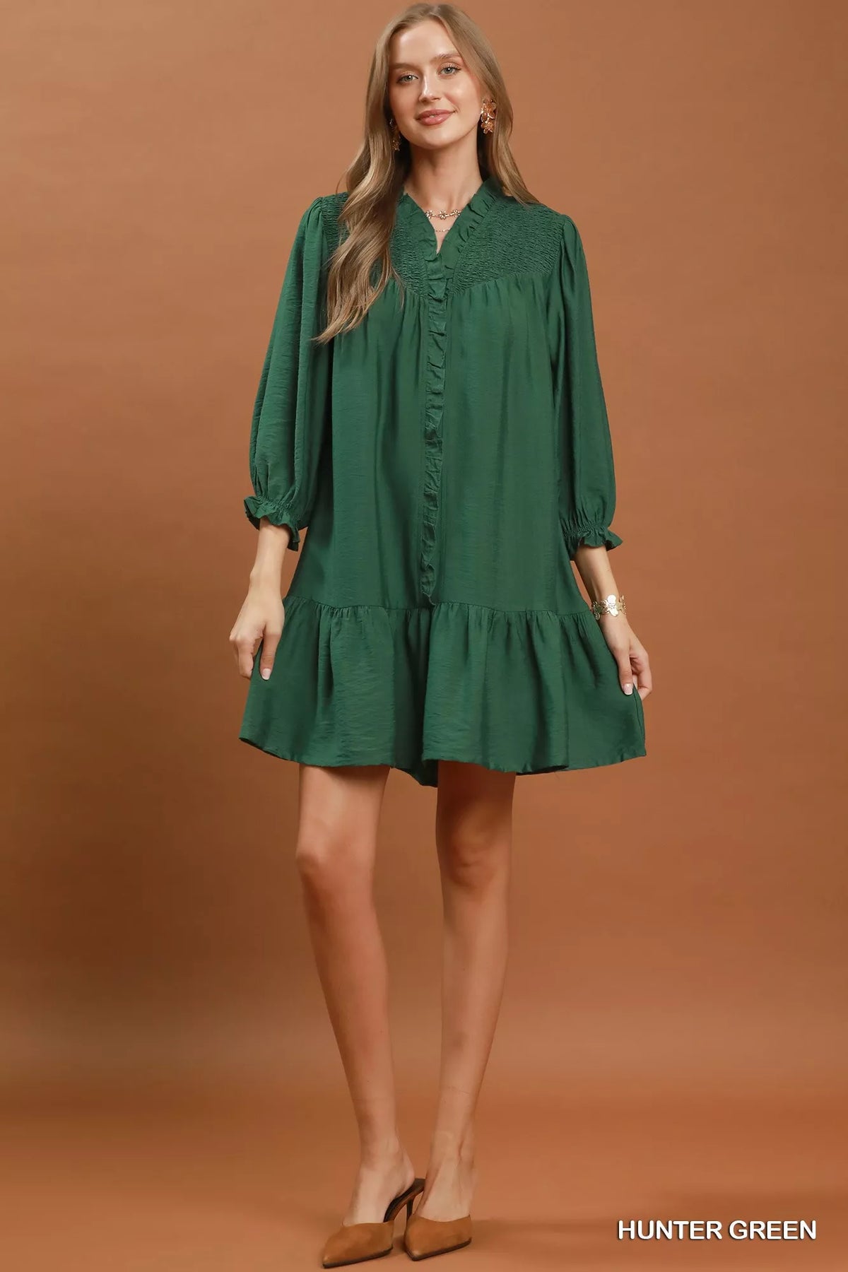 Tiered skirt detail on the hunter green mini dress