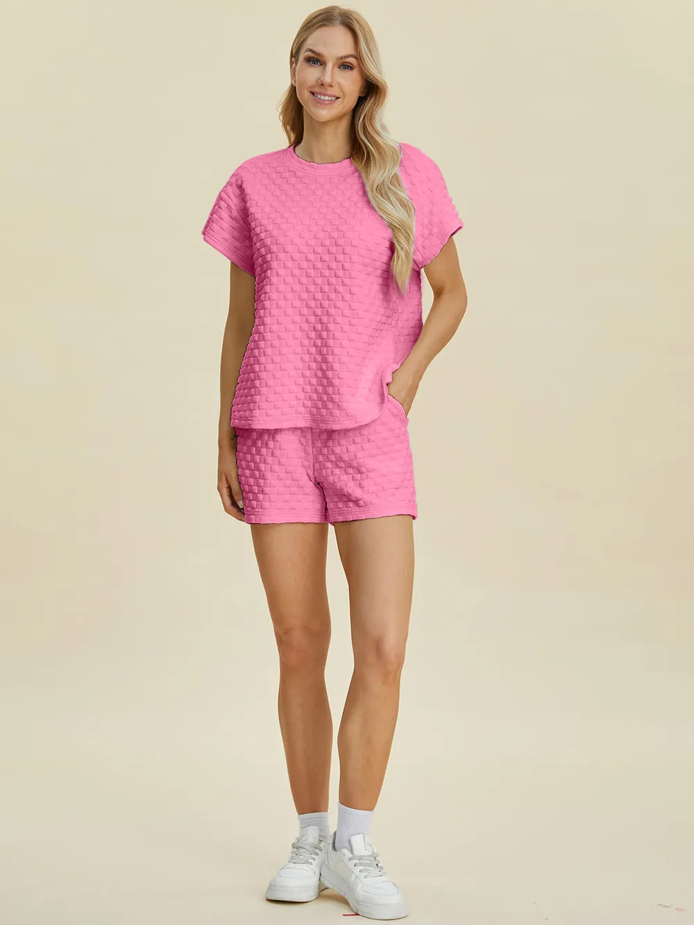 Drawstring shorts shown from the waist down