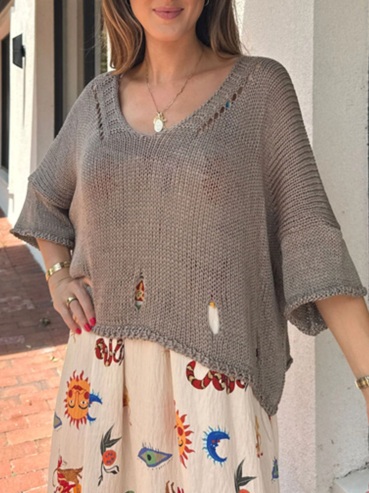 Cutout three quarter sleeve knit sweater front view