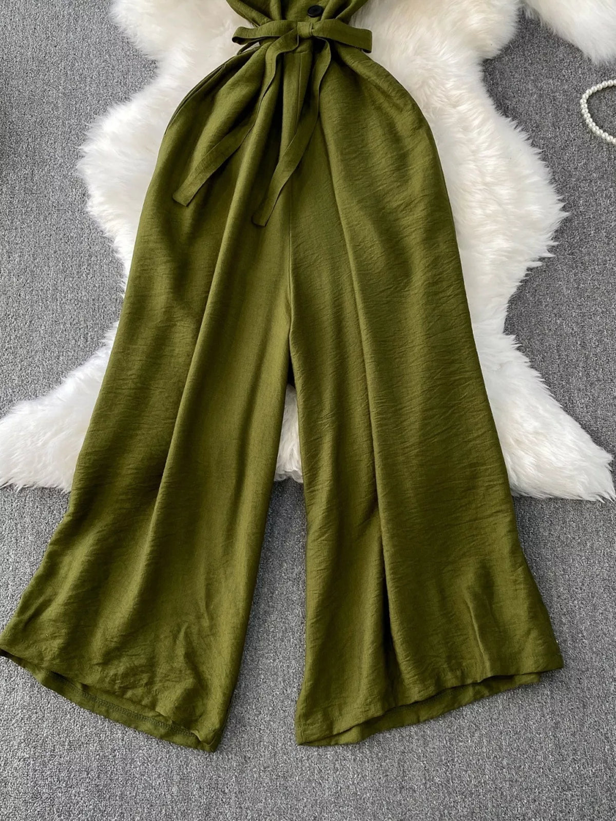 Green wide leg jumpsuit fabric detail