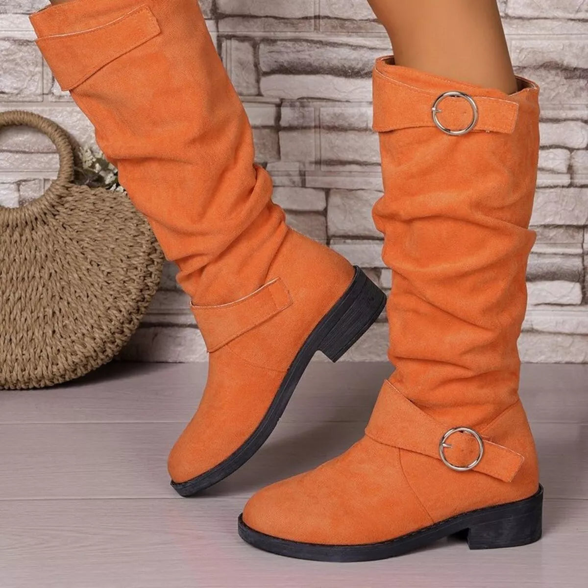 Suede slouch boots styled with denim