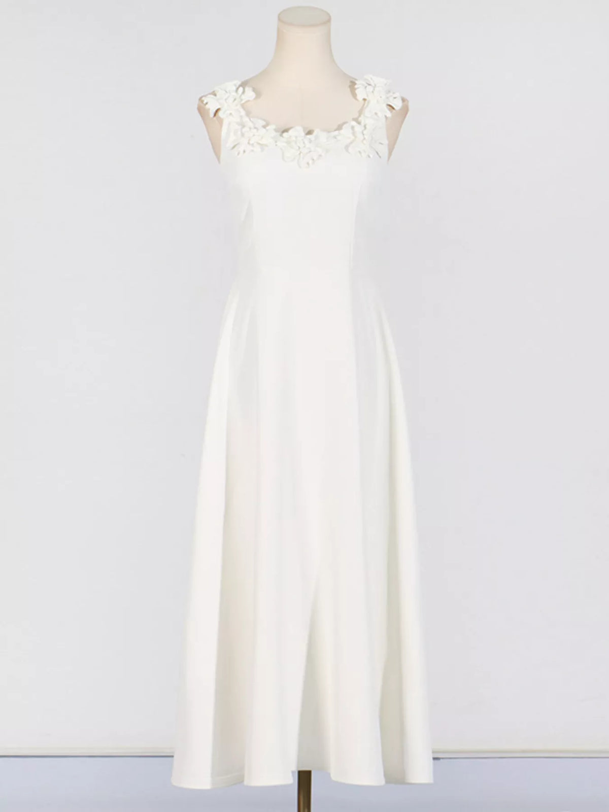 White floral midi dress styled on model