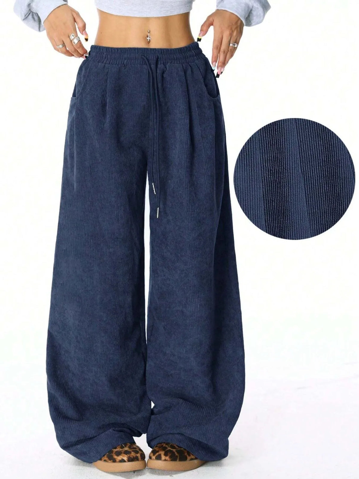 Drawstring wide leg pants seated pose