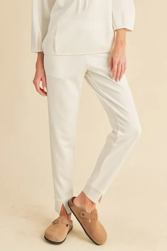 Elastic waist joggers in cream front view