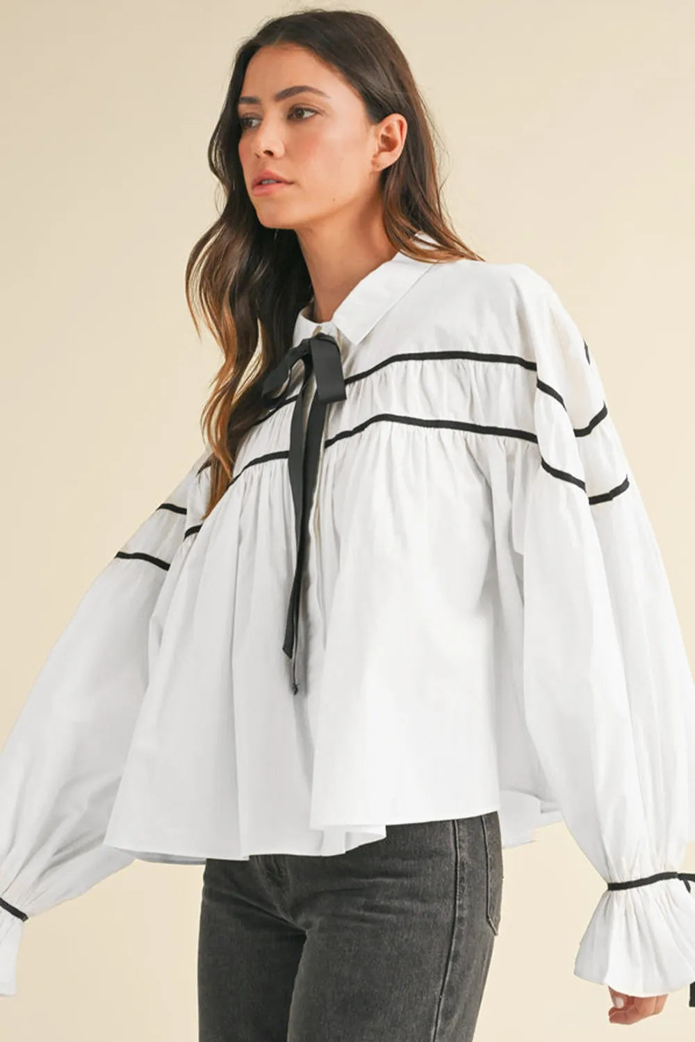 White shirt showing ribbon bow collar detail