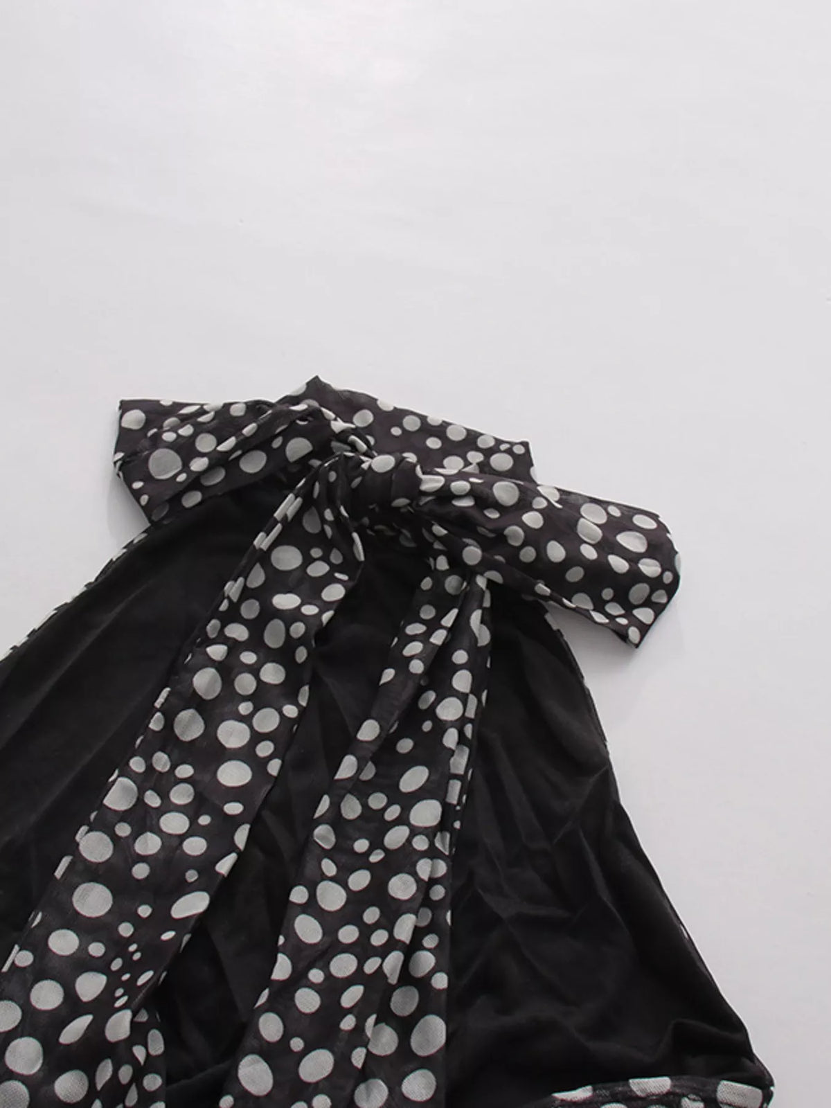 Black halter neck polka dot maxi dress, fabric and print close up