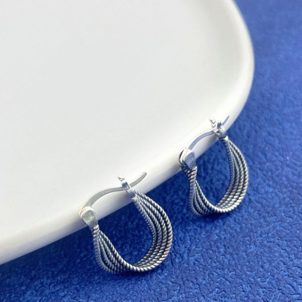 Silver hoop earrings pair closeup