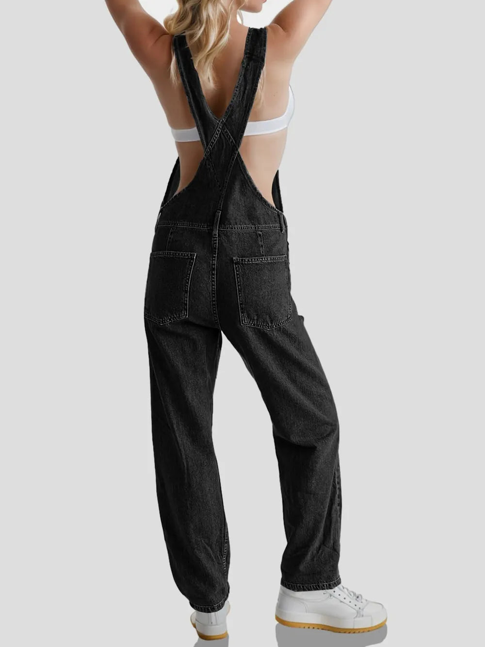 Black denim overall dress side and pocket detail