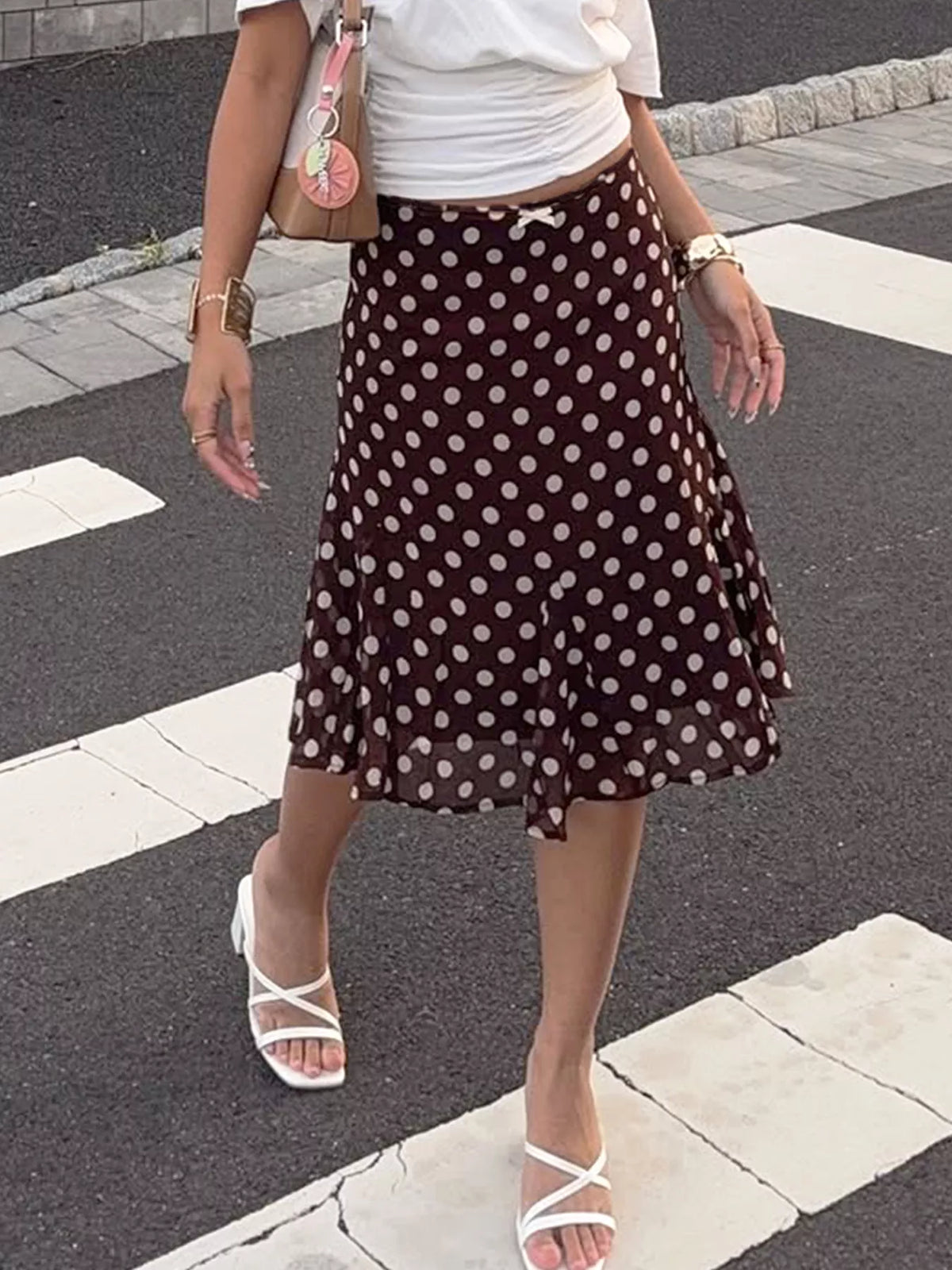 Dark brown polka dot midi skirt front view