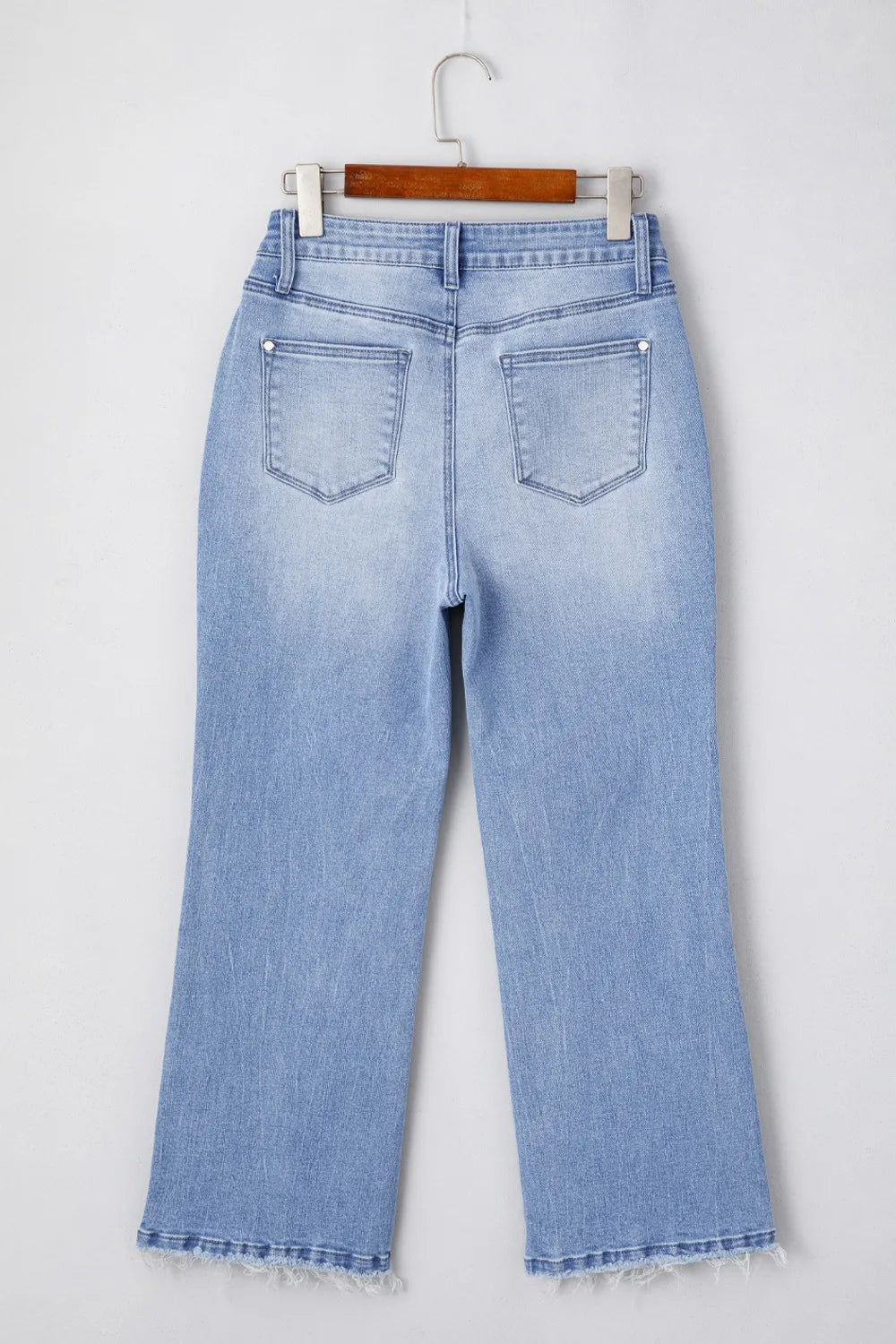 Waist and pocket detail on flare jeans