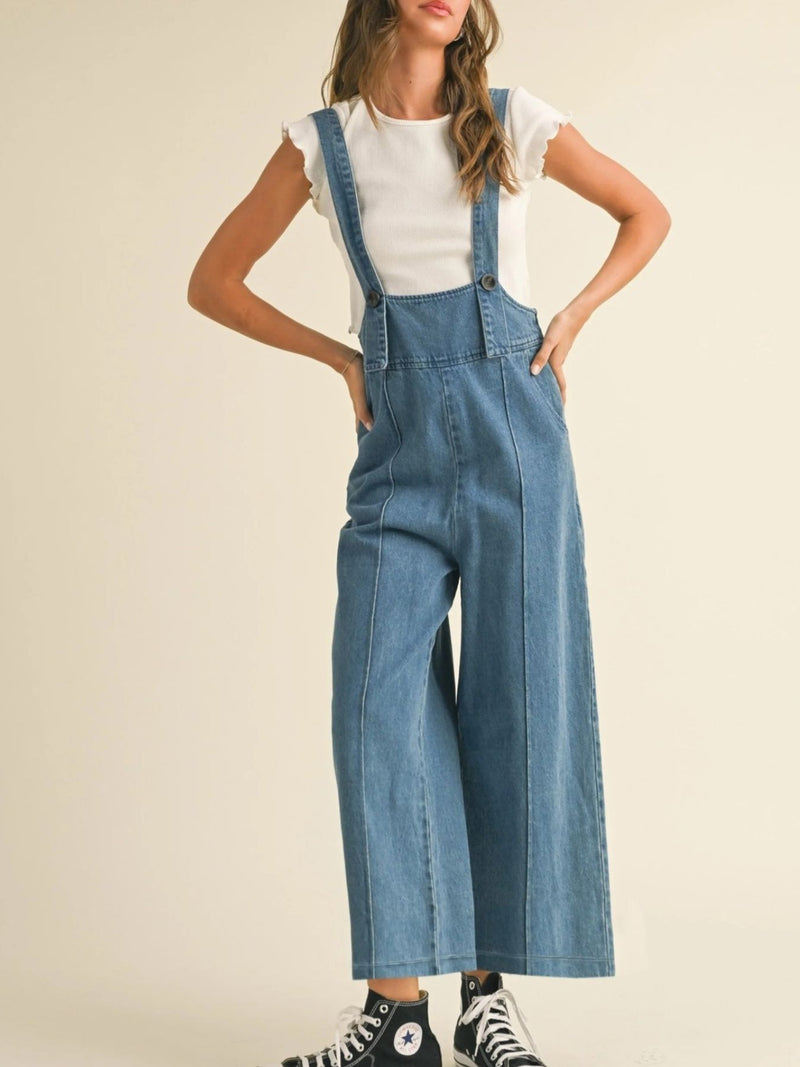 Blue wide leg denim overalls front view on model