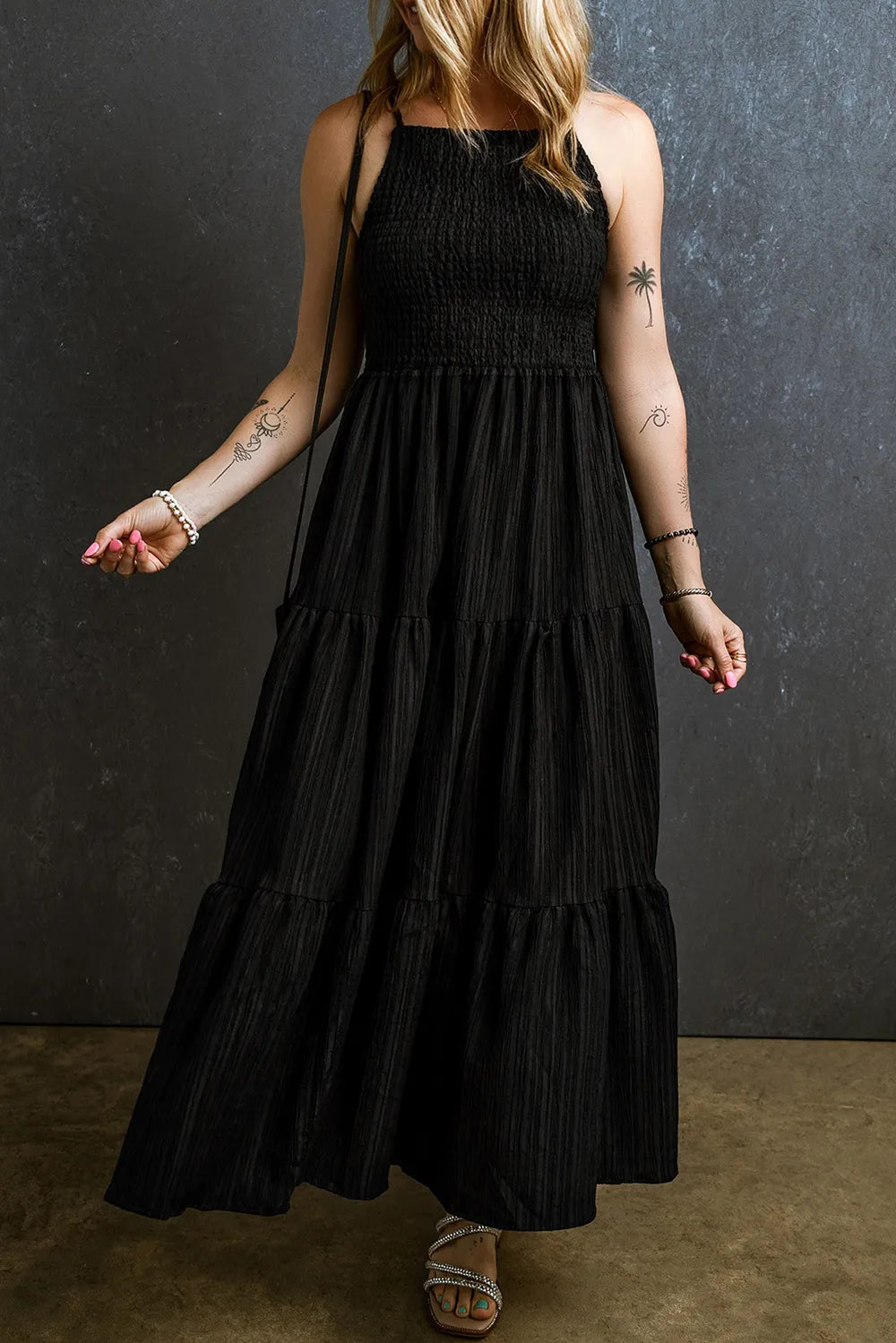 Black smocked tiered spaghetti strap maxi dress, front view