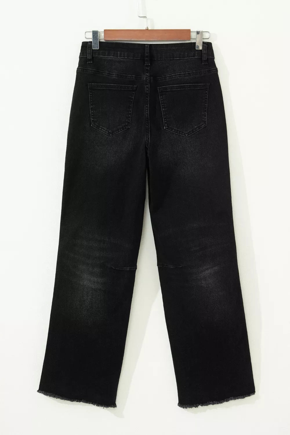 Straight leg black denim jeans on model