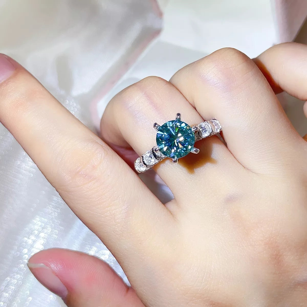 Starglow 3 carat turquoise moissanite ring in sterling silver, front view