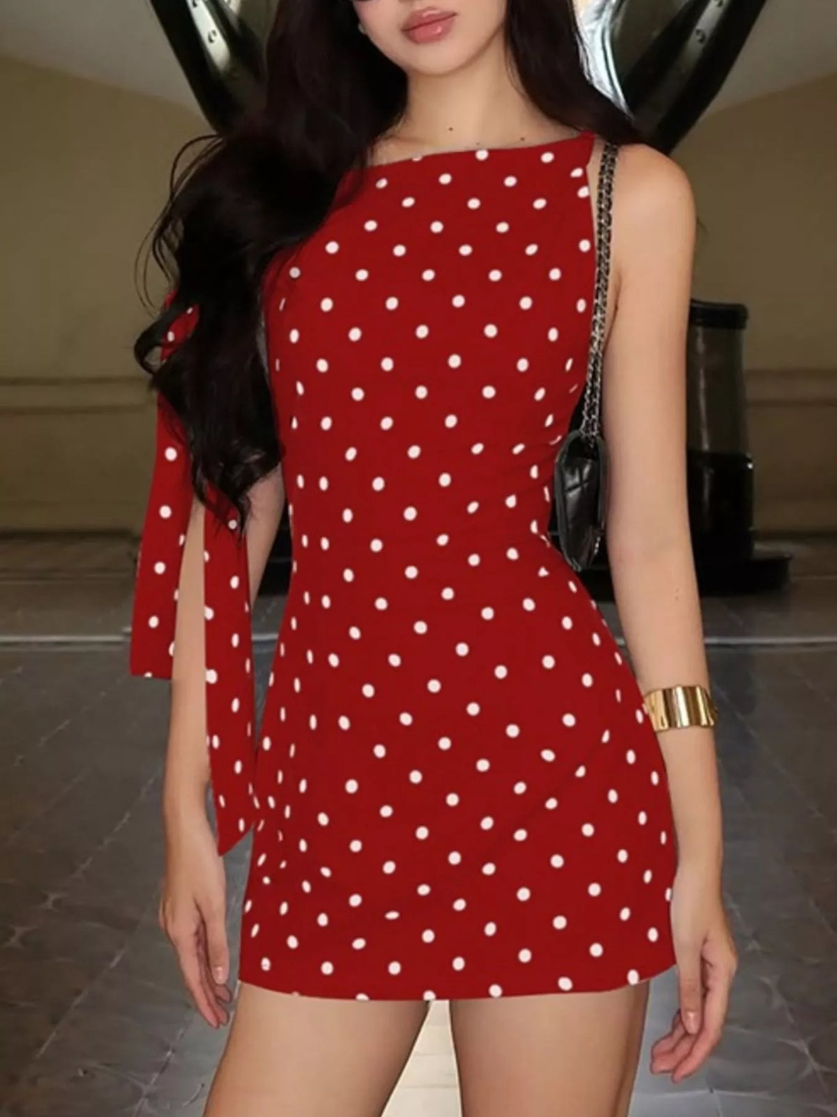 Back view of the red polka dot bow accent dress