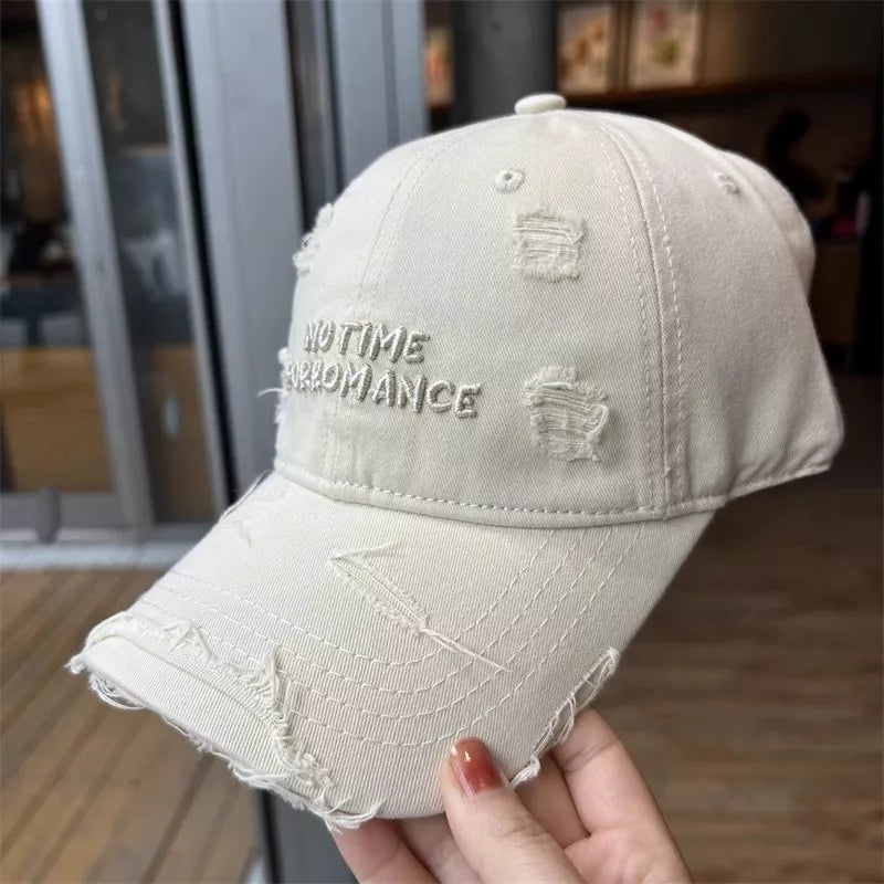 Distressed brim and embroidery detail close up