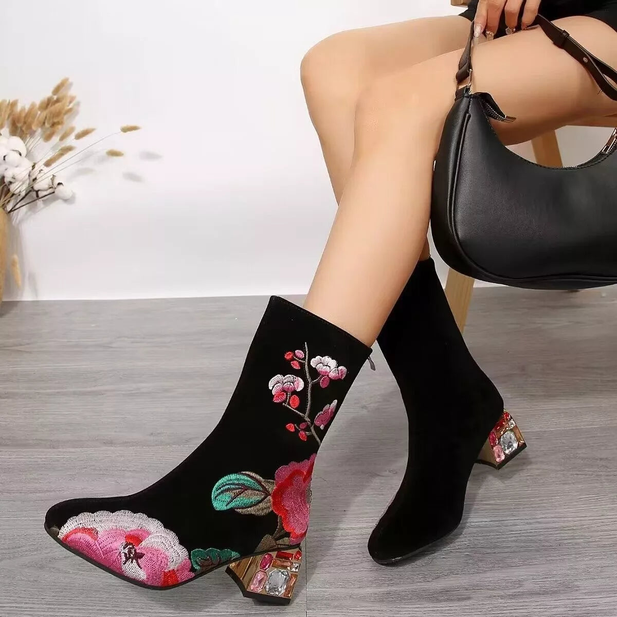 Floral embroidered rhinestone block heel boots heel detail