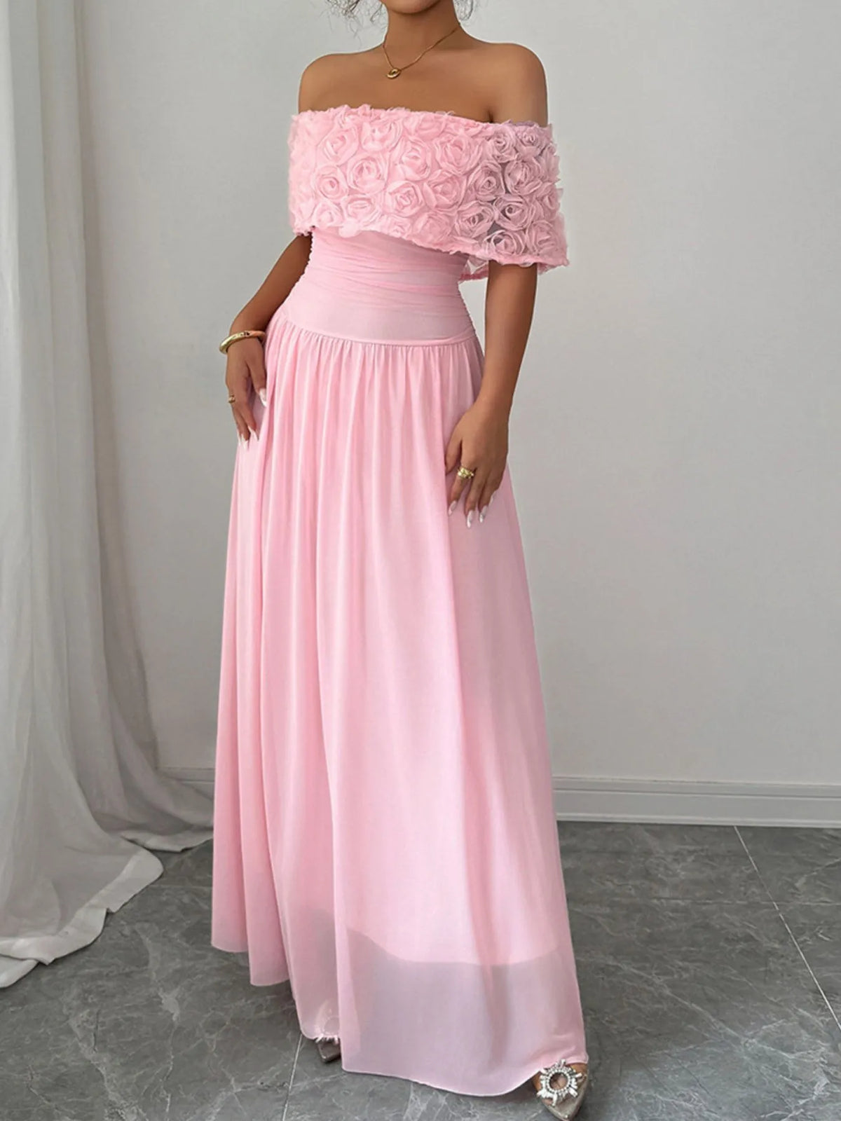 Off shoulder maxi dress showing rose embellishment