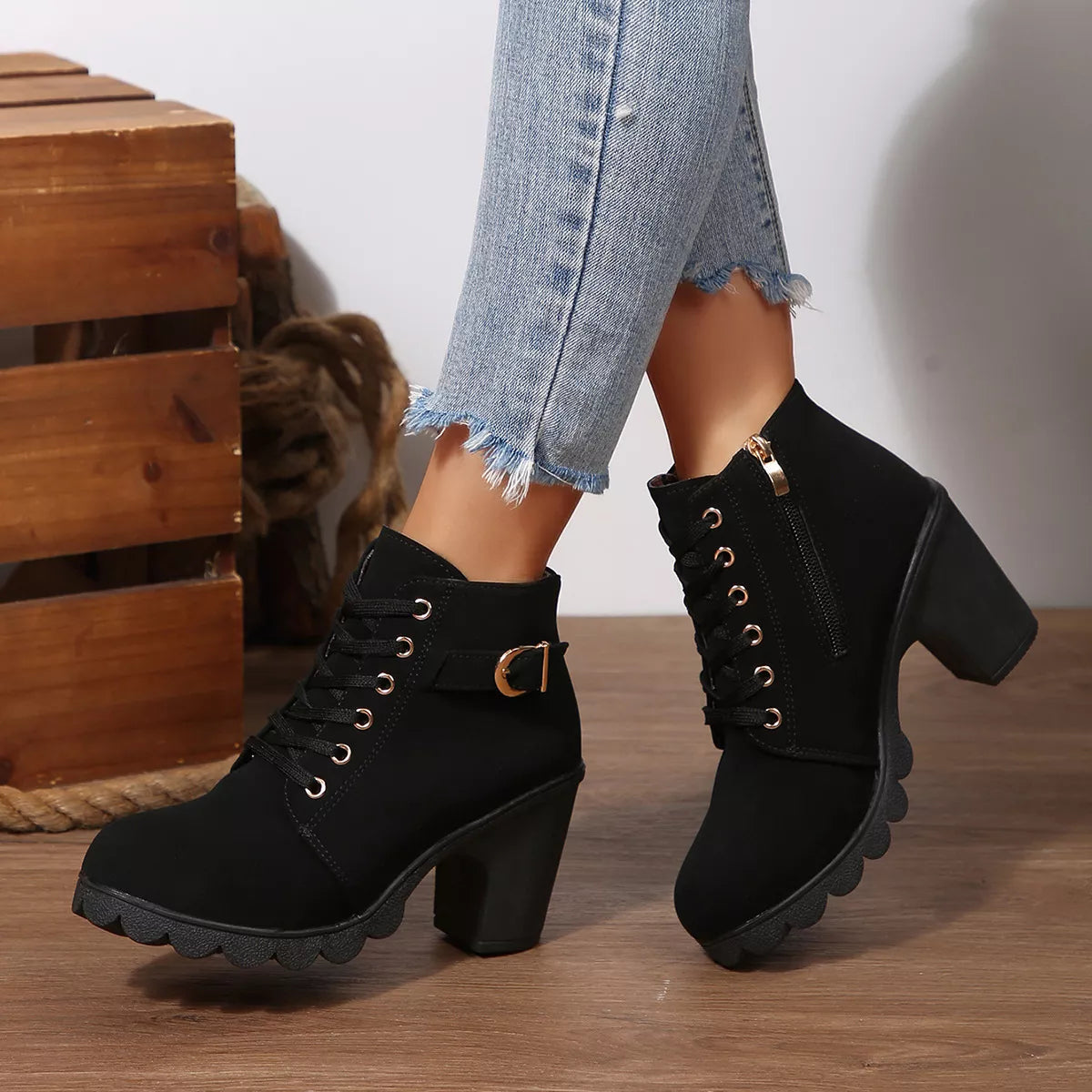 Lace up block heel suede boots styled on model