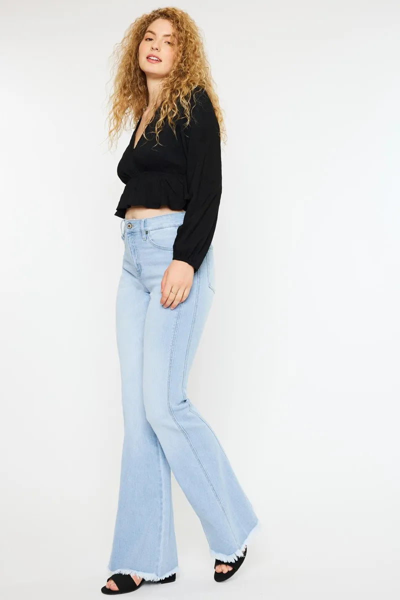 Light wash flare denim raw hem detail
