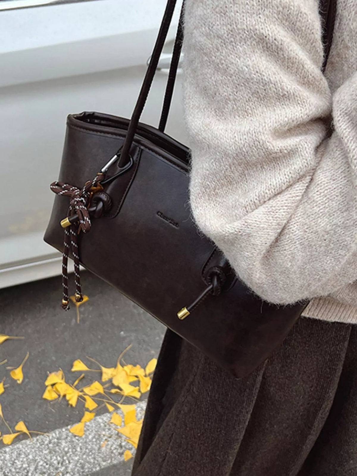 Leather shoulder bag styled with outfit