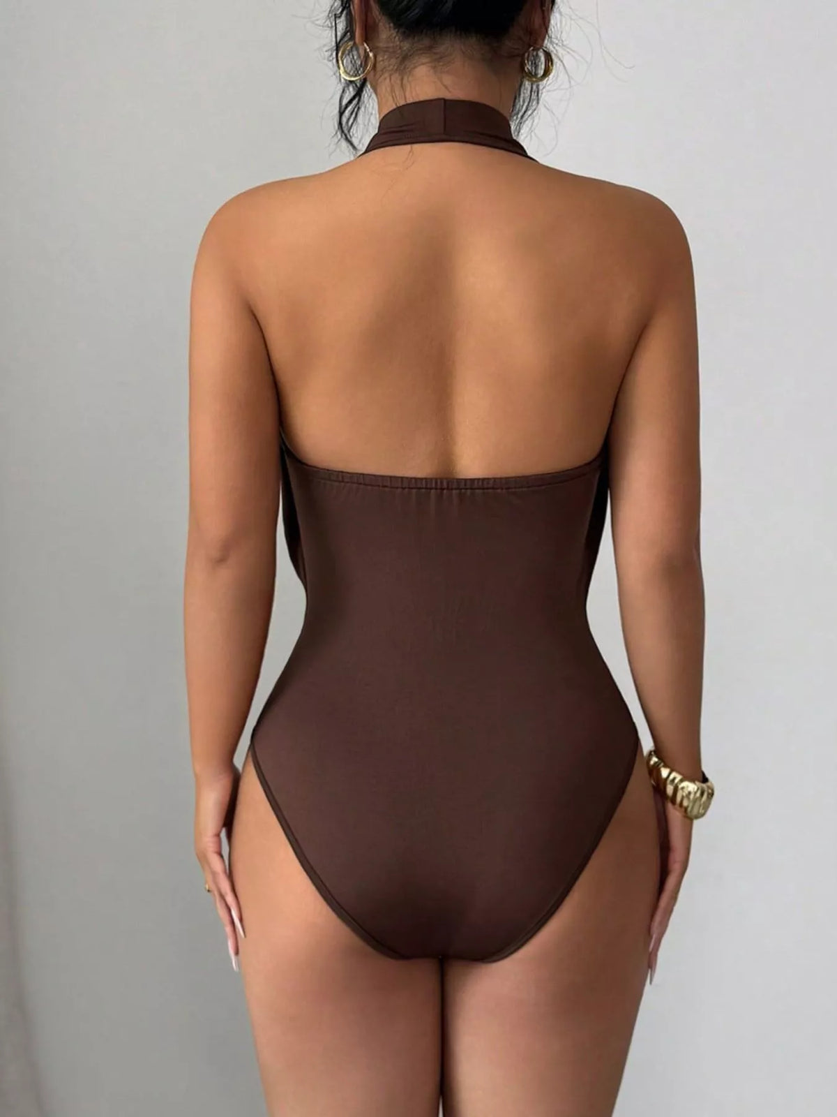 Close up of the ring detail on a halter neck bodysuit