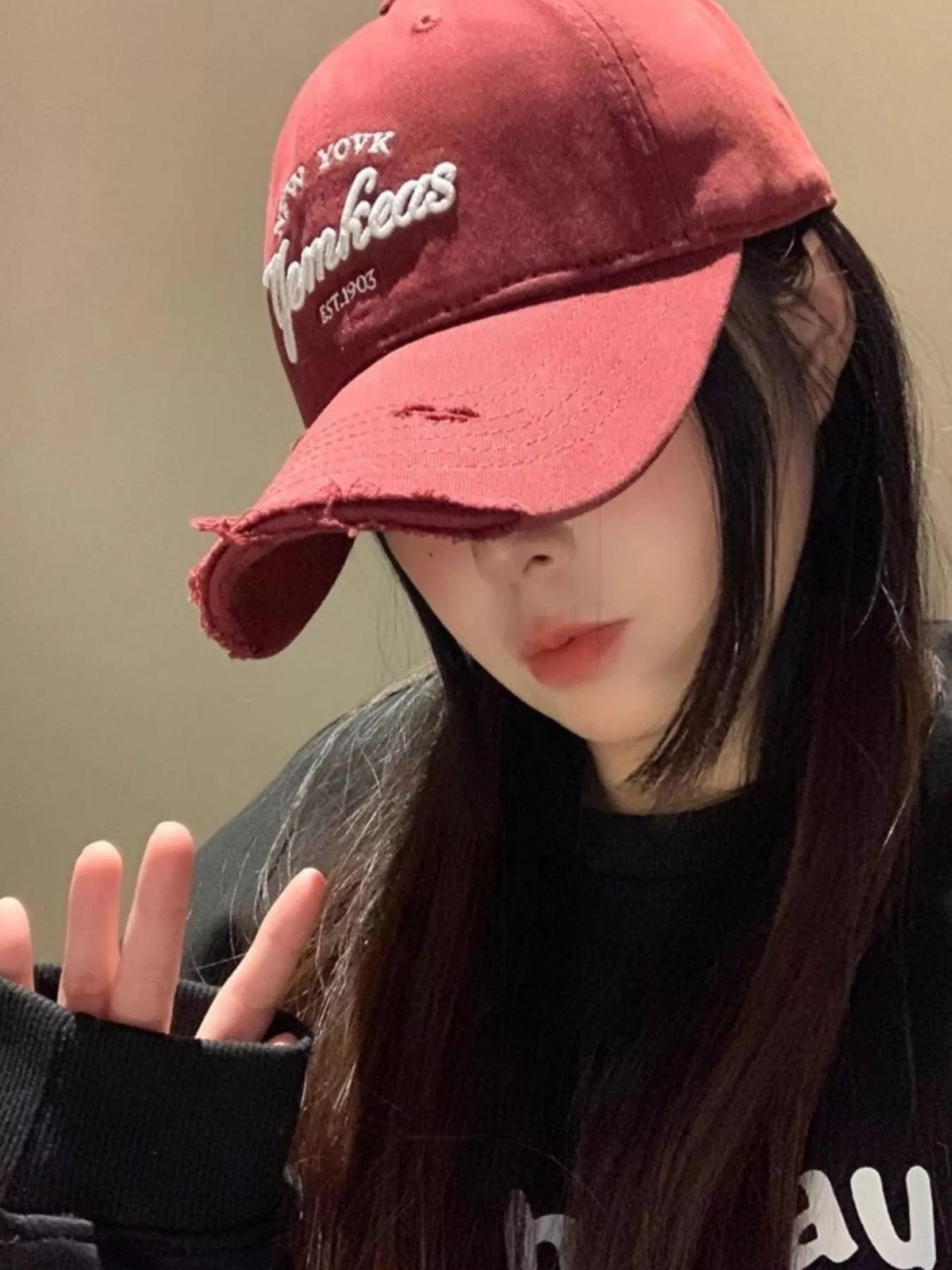 Side profile of the wine red embroidered cap