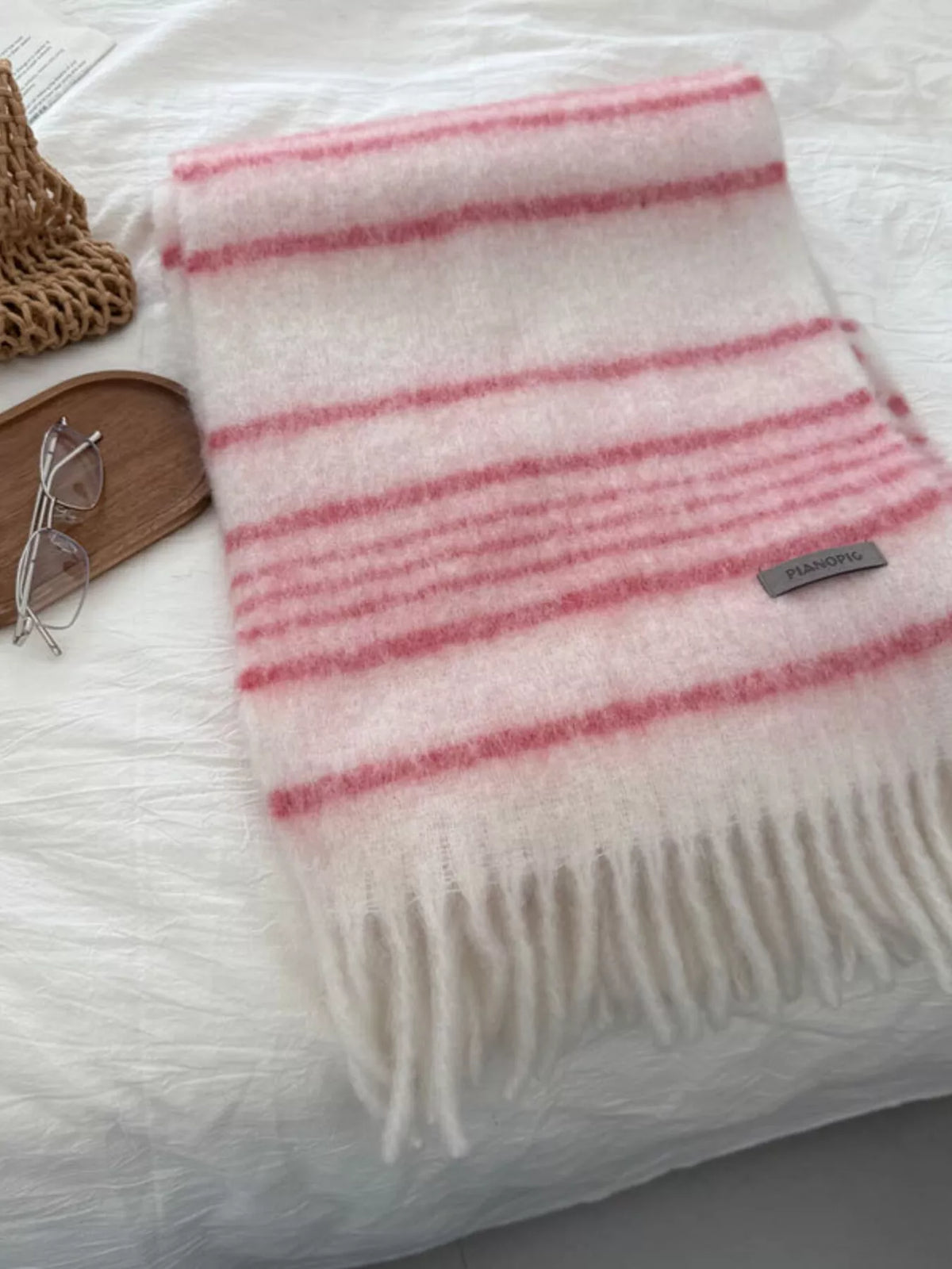 Cozy striped scarf shown in a warm color option