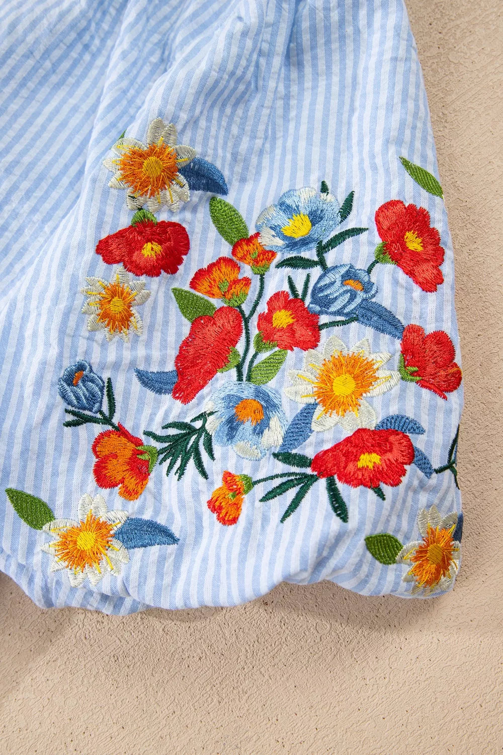 Light blue striped floral embroidered puff sleeve shirt detail view