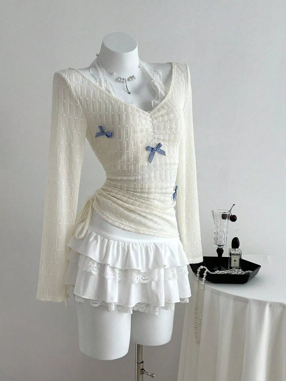 Close up of the lace trim at the V neckline