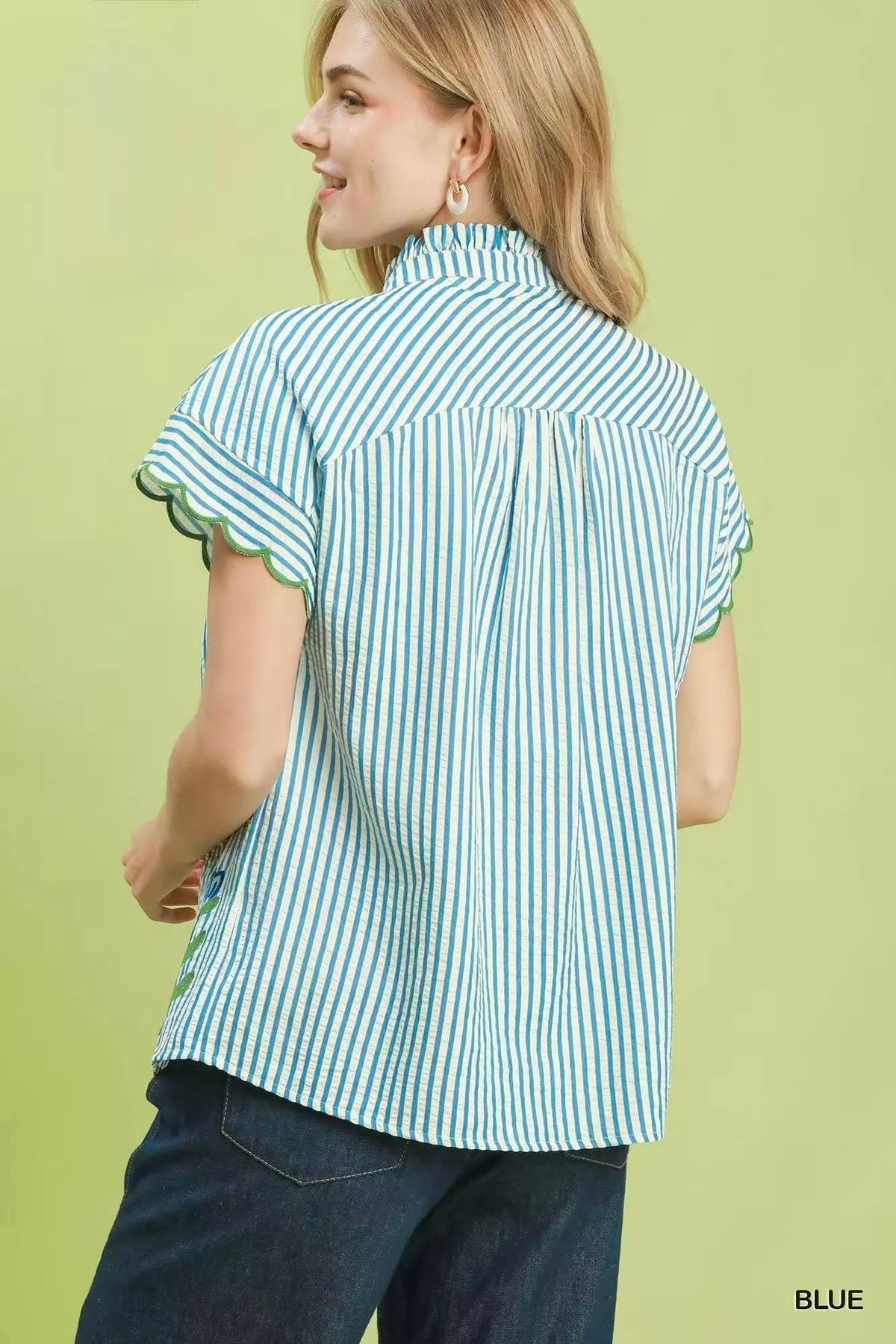 Blue button front striped top side view