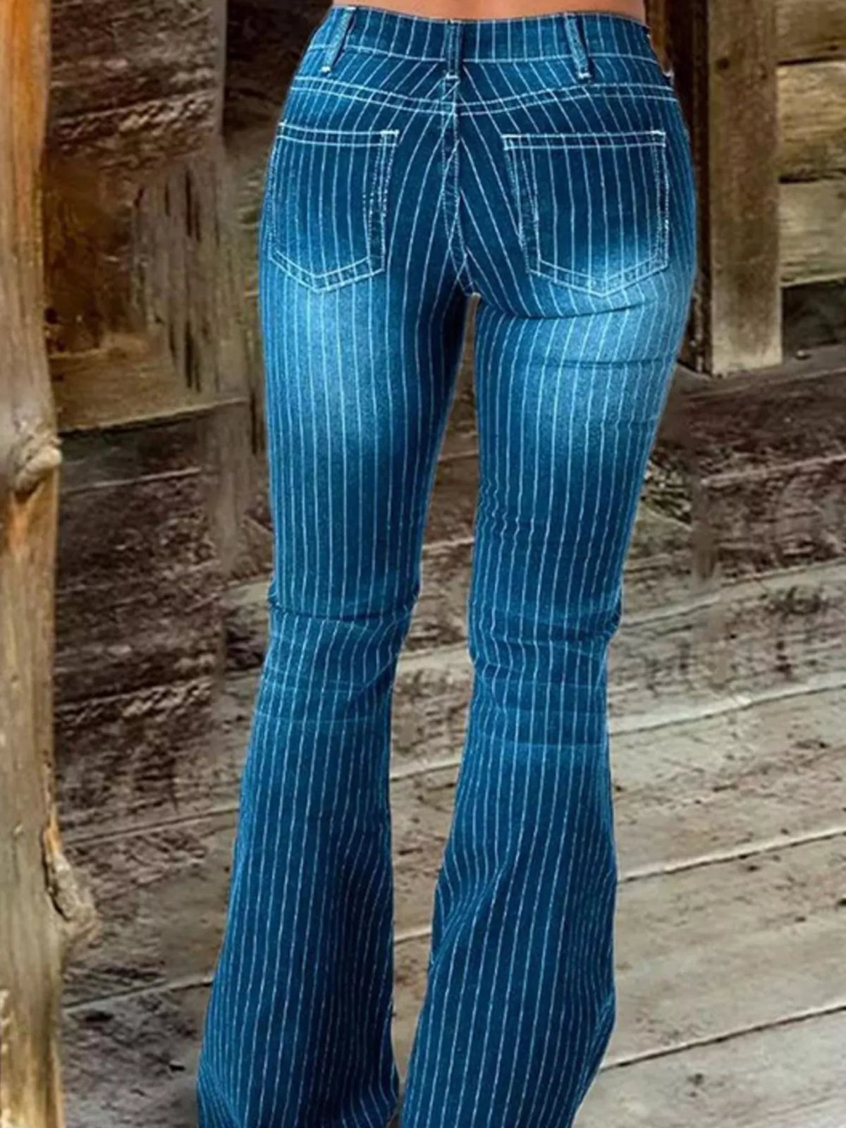 Button fly and stripe detail on flare jeans