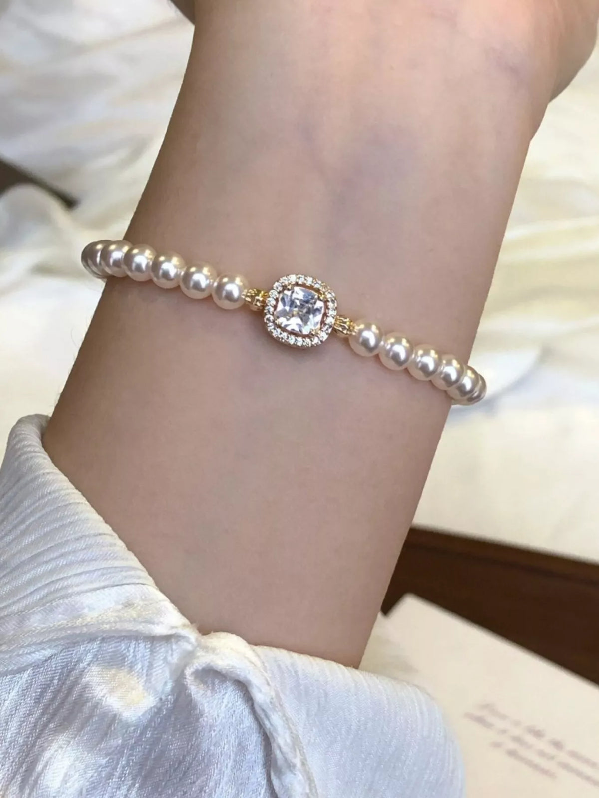 gold plated pearl bracelet on model