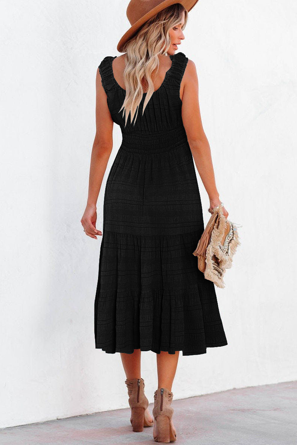 Black pleated midi dress side profile view