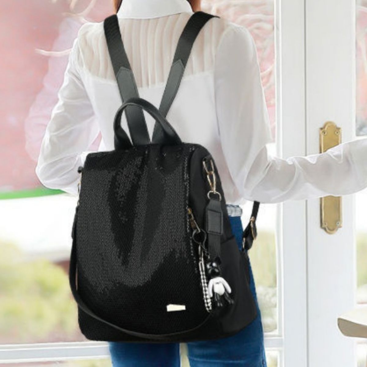 Black sequin backpack side profile