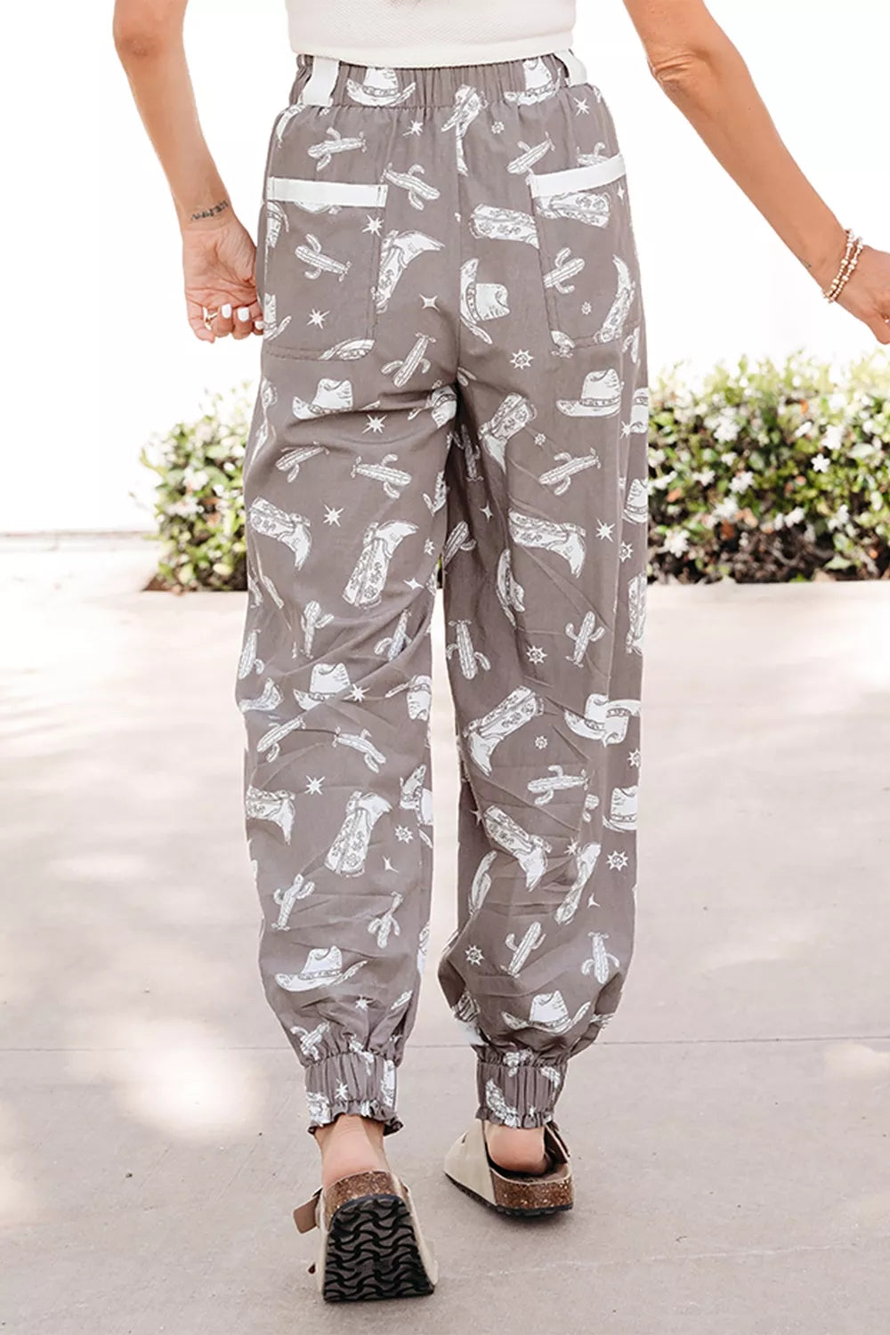 Mocha western cactus print drawstring jogger pants, side view