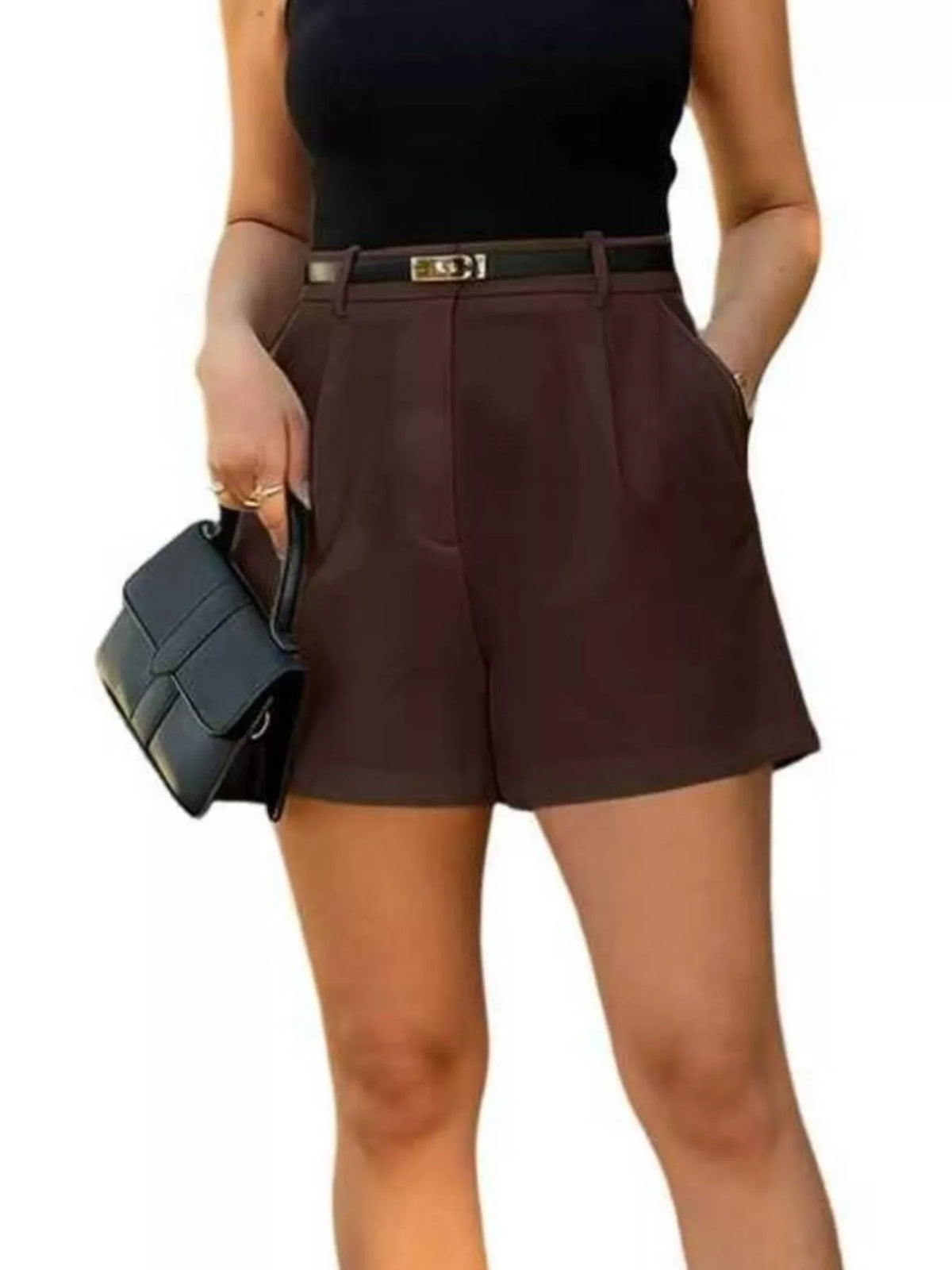 White pleated shorts styled with a linen shirt