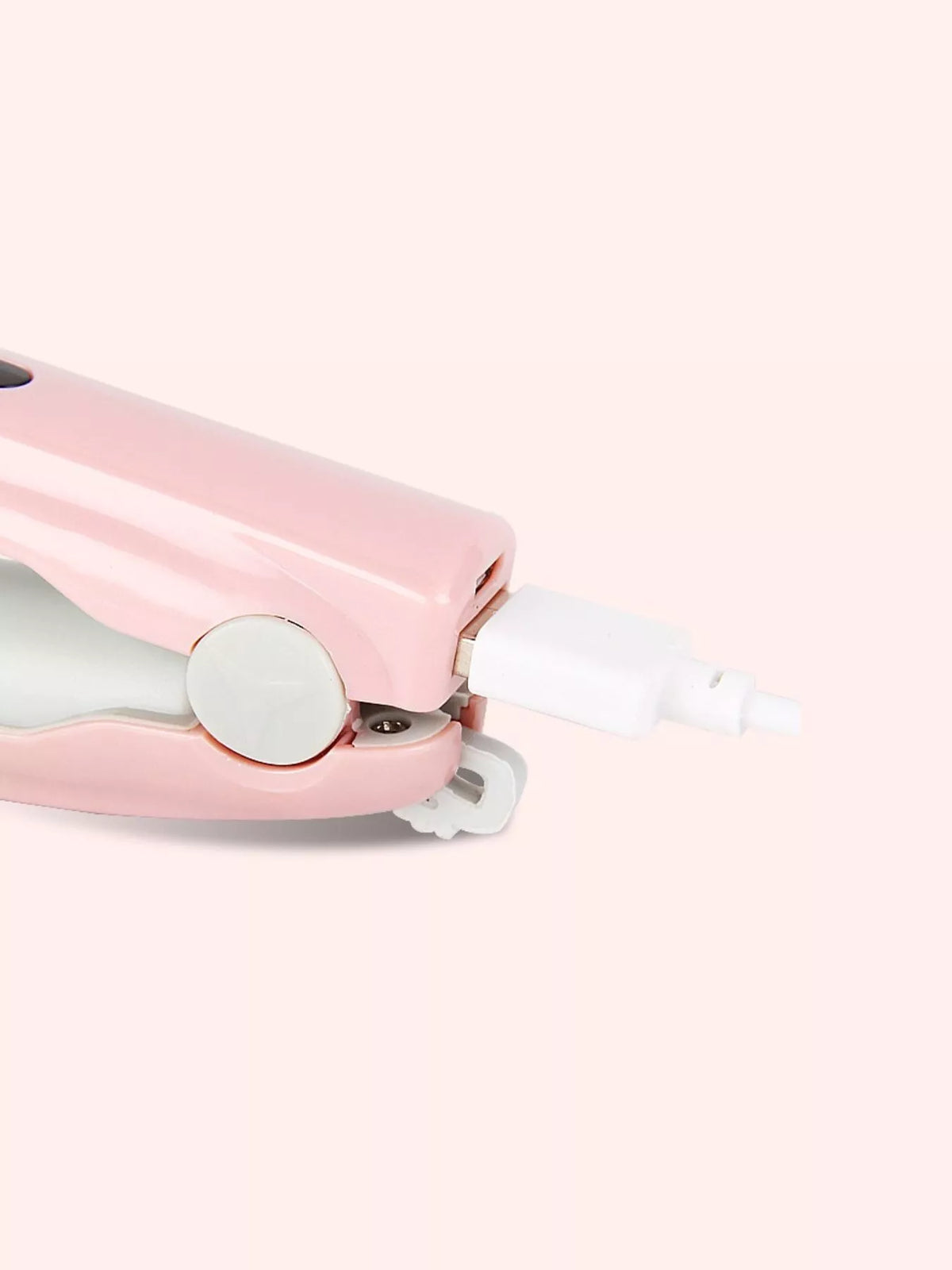 Compact straightener held in hand