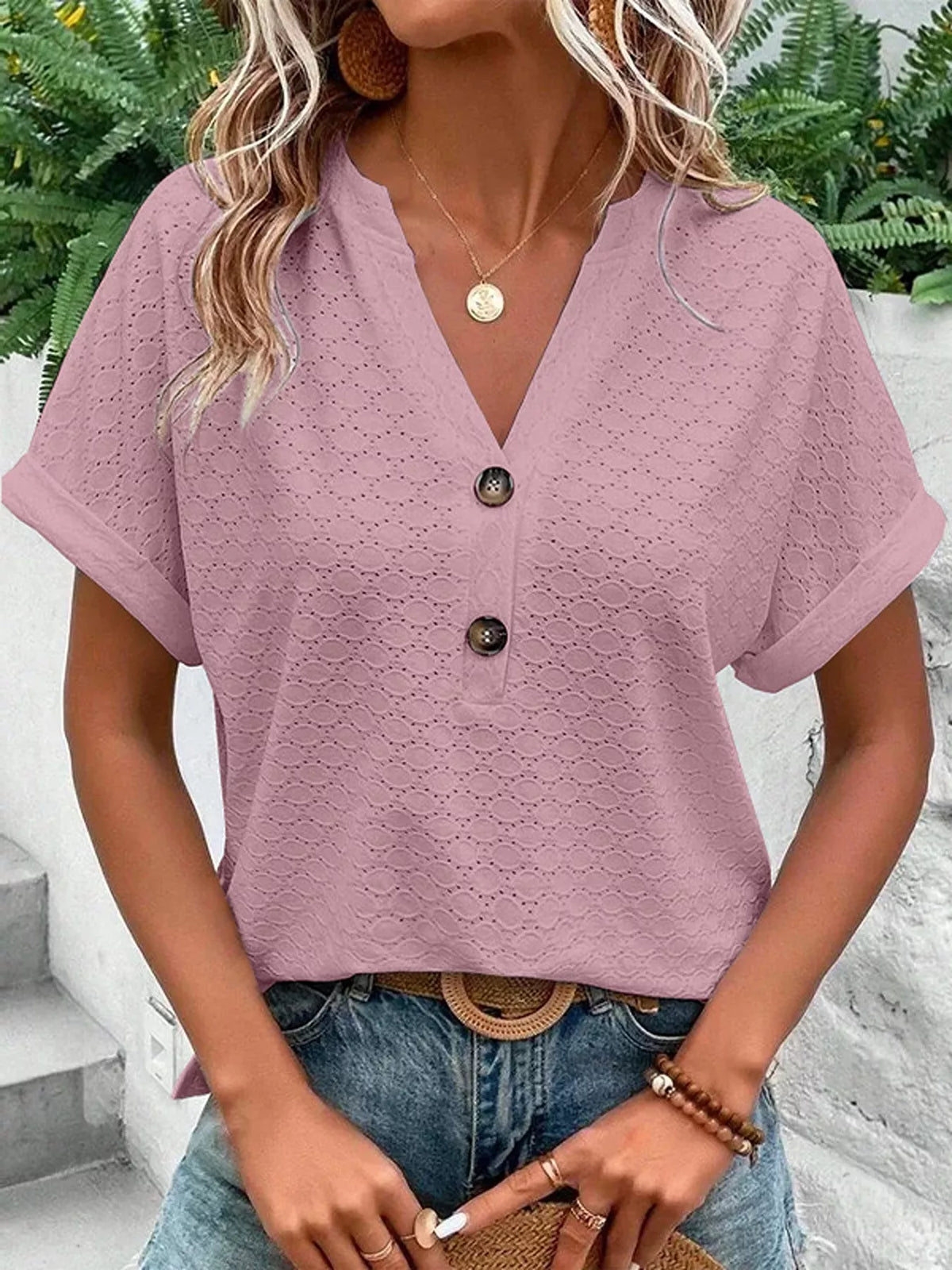 Casual notched neck top shown tucked at the waist