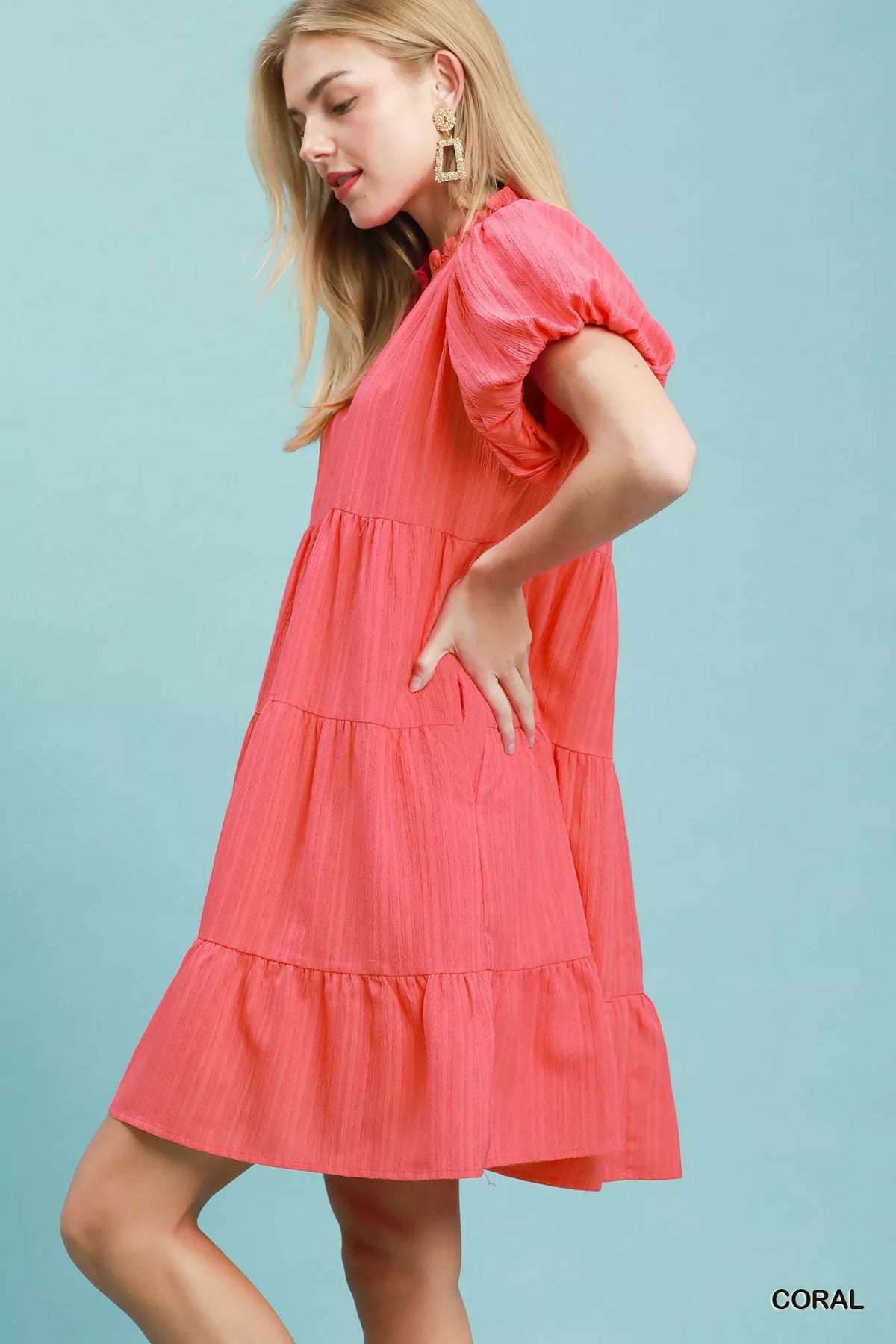 Coral puff sleeve tiered babydoll mini dress side view