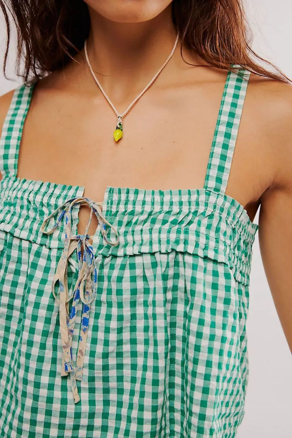 Woman wearing tied front textured square neck cami top