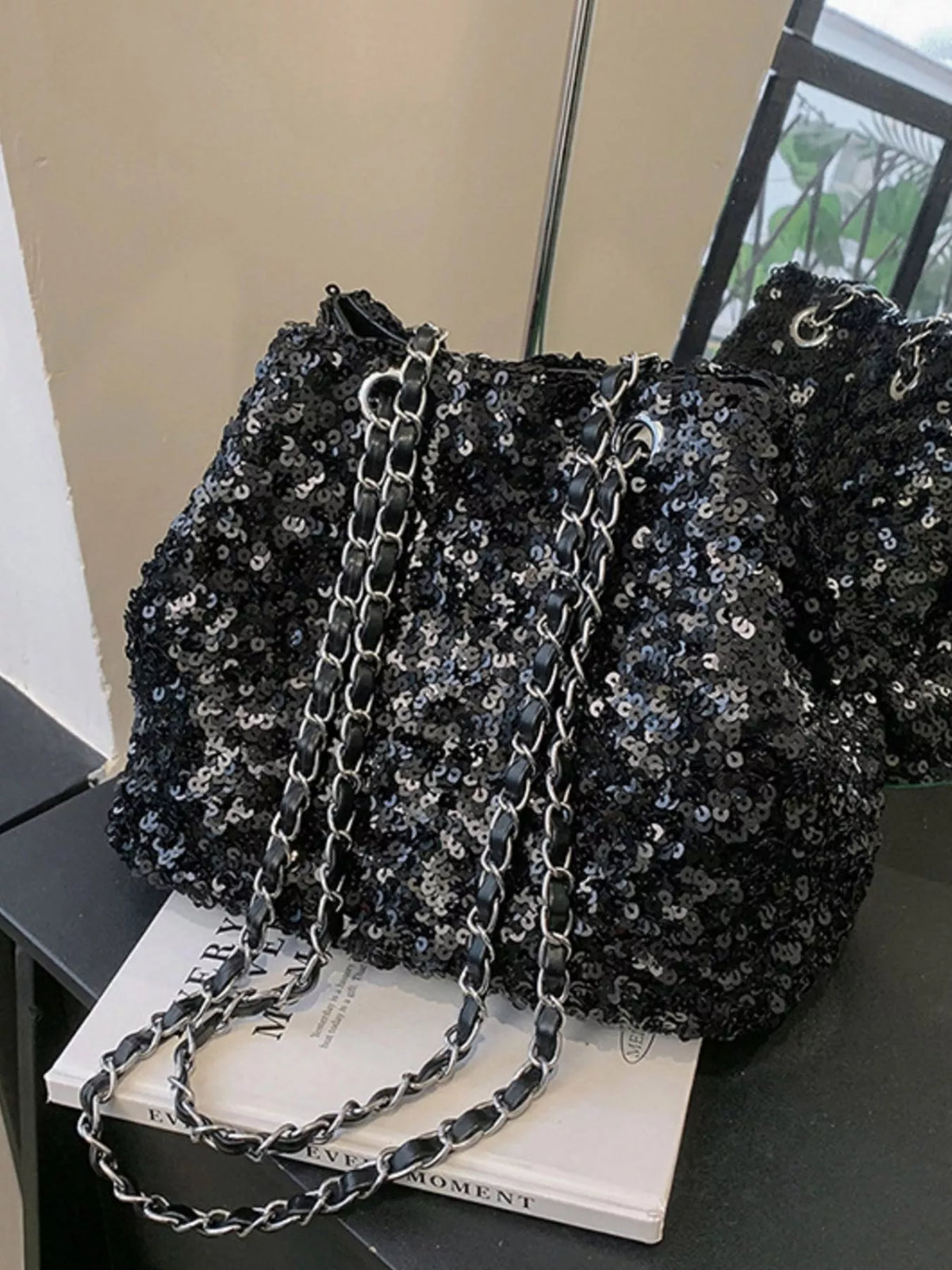 Black sequin bucket bag side profile