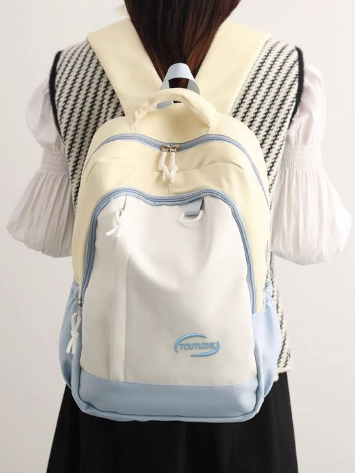 Color block backpack side profile showing straps